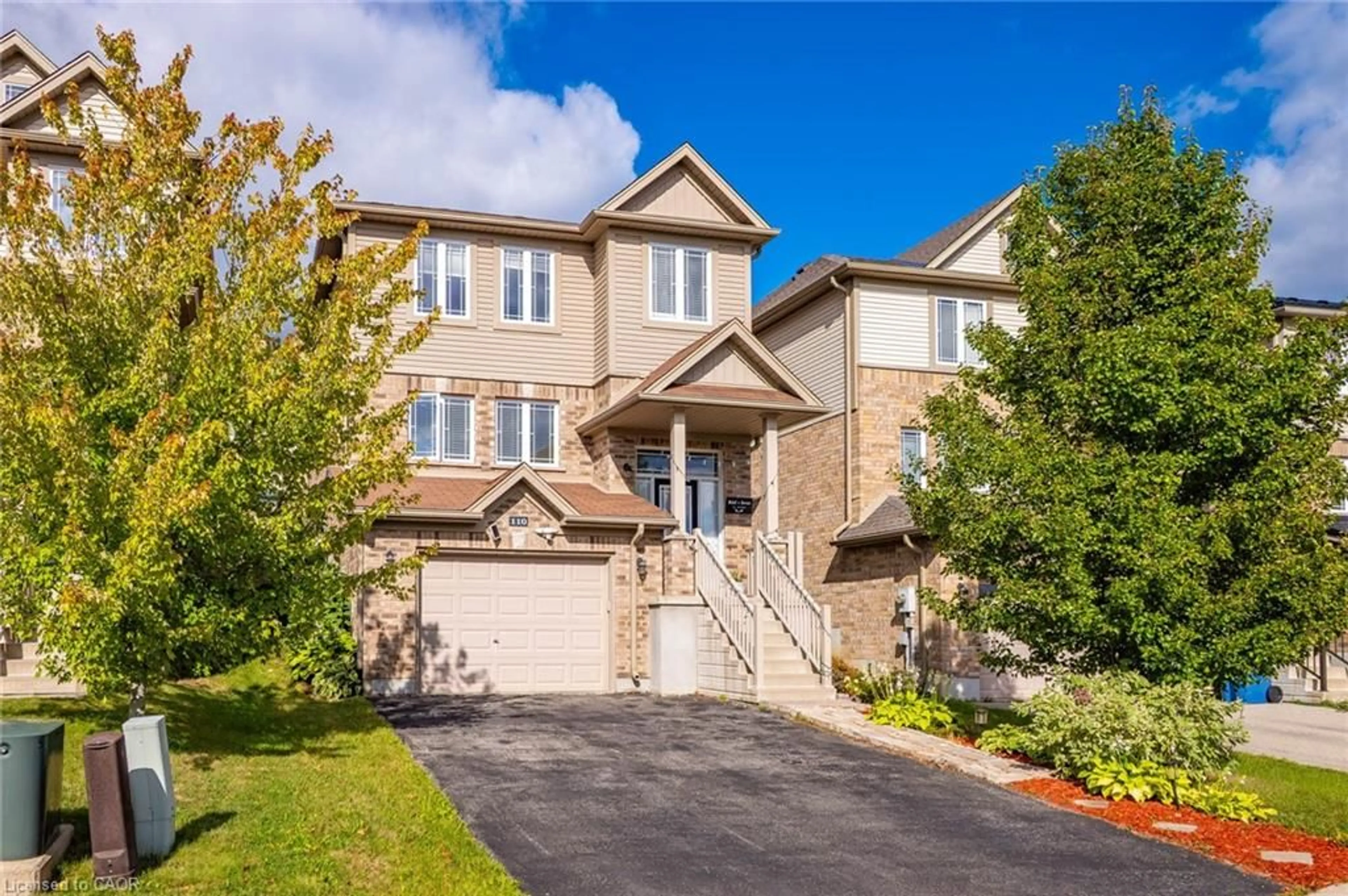 Home with brick exterior material, street for 110 Oakes Cres, Guelph Ontario N1E 0J5