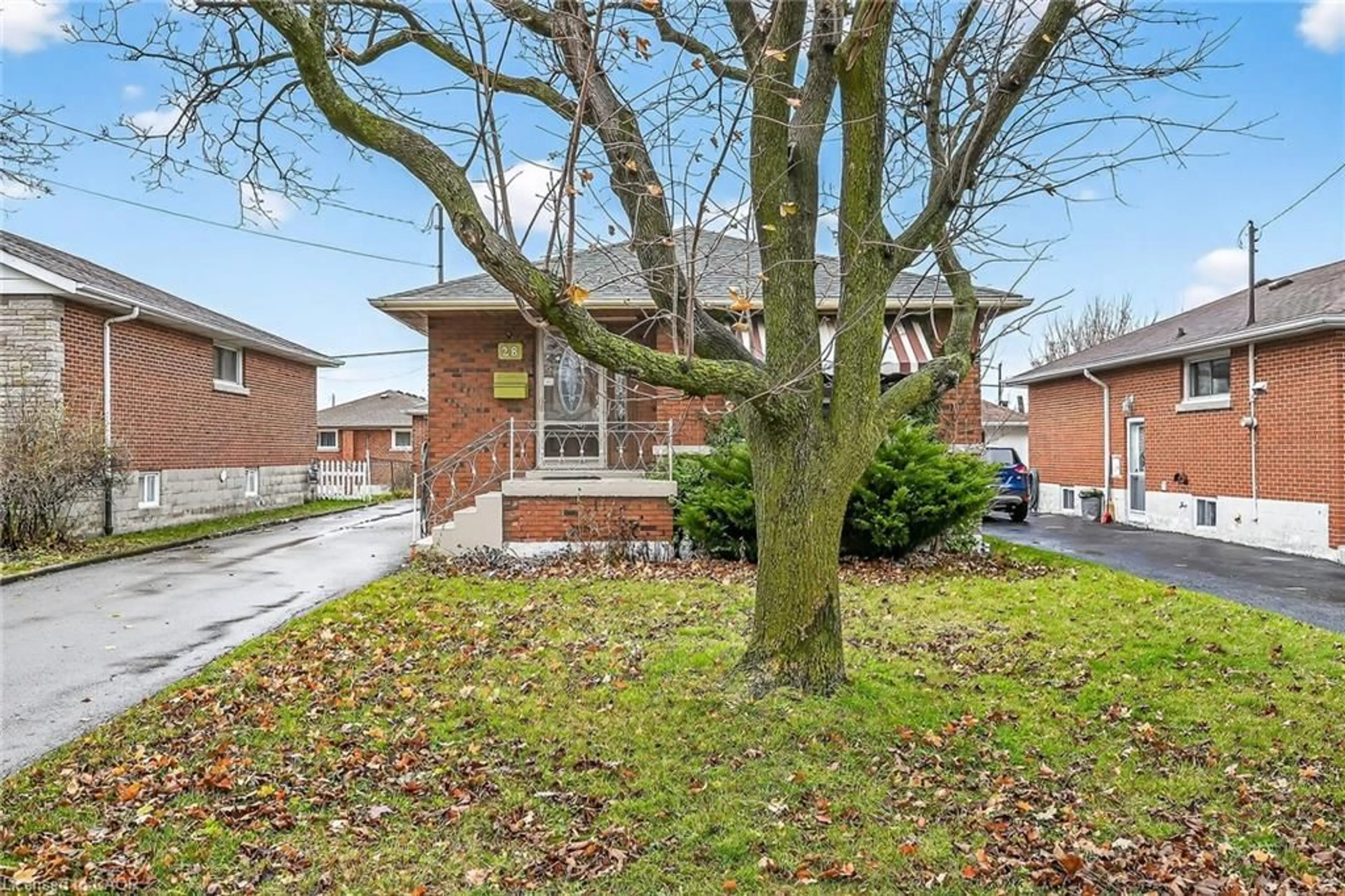 Home with brick exterior material, street for 28 Warren Ave, Hamilton Ontario L9A 3C6