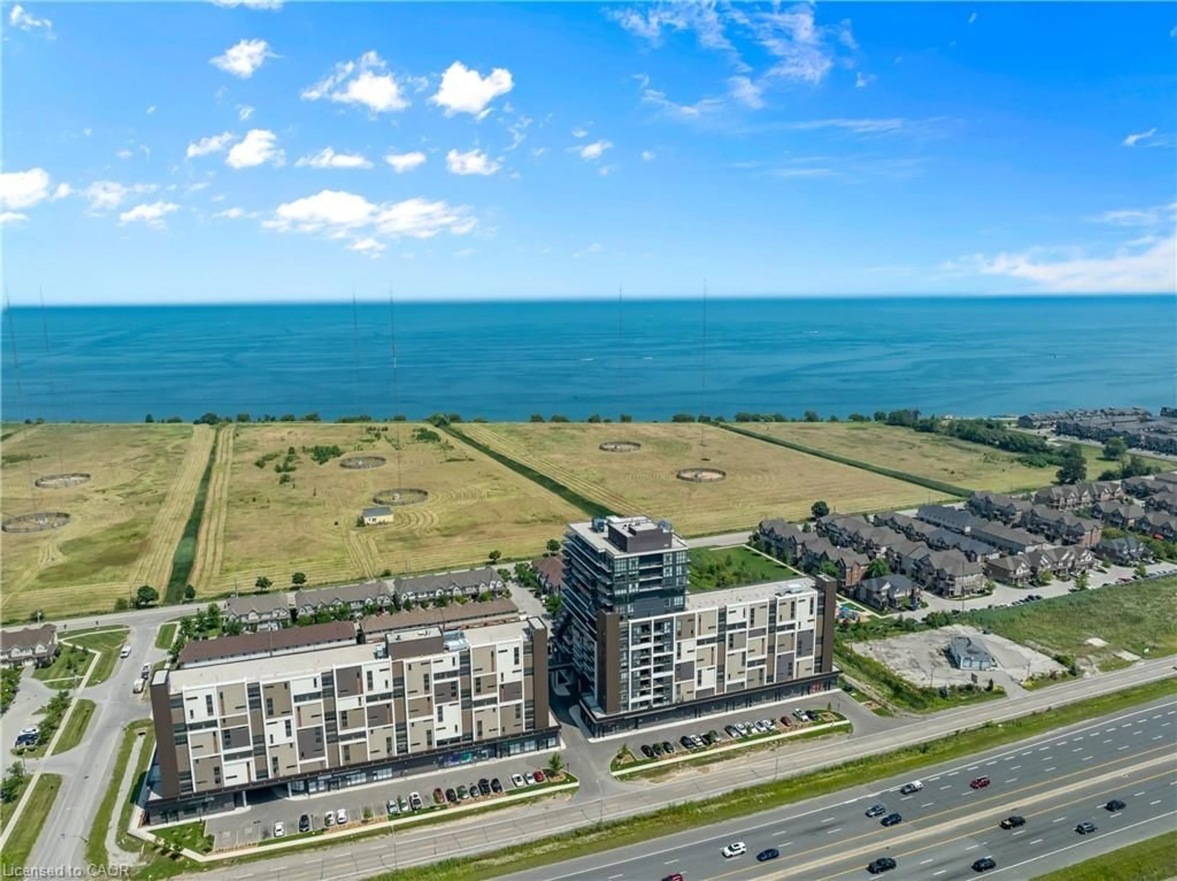 A pic from outside/outdoor area/front of a property/back of a property/a pic from drone, water/lake/river/ocean view for 550 North Service Rd #218, Grimsby Ontario L3M 0H9