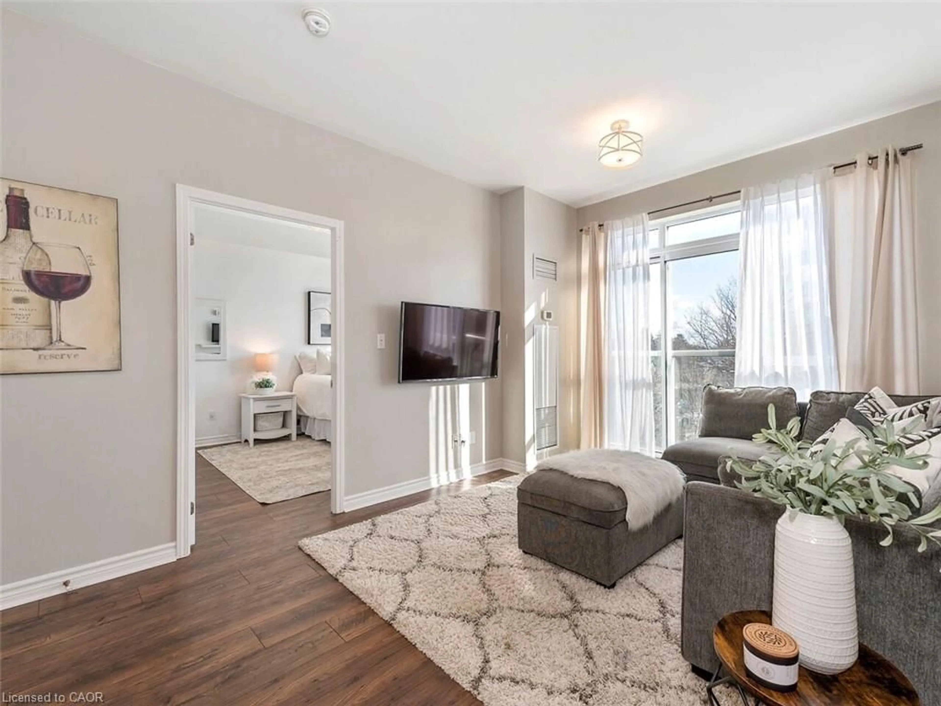 Living room with furniture, wood/laminate floor for 3865 Lake Shore Blvd #401, Etobicoke Ontario M8W 0A2