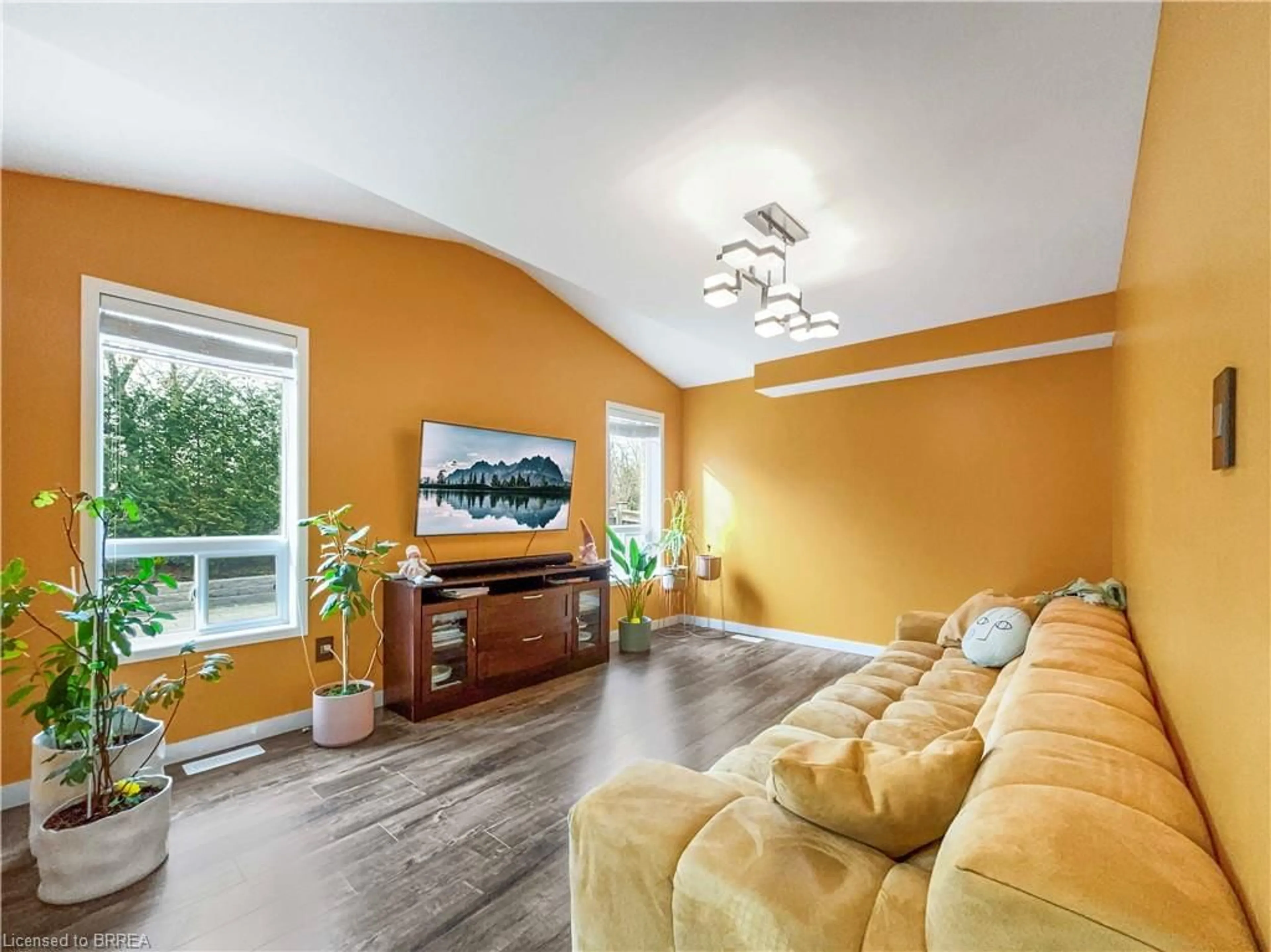 Living room with furniture, wood/laminate floor for 39 Barrett Ave, Brantford Ontario N3S 0B5