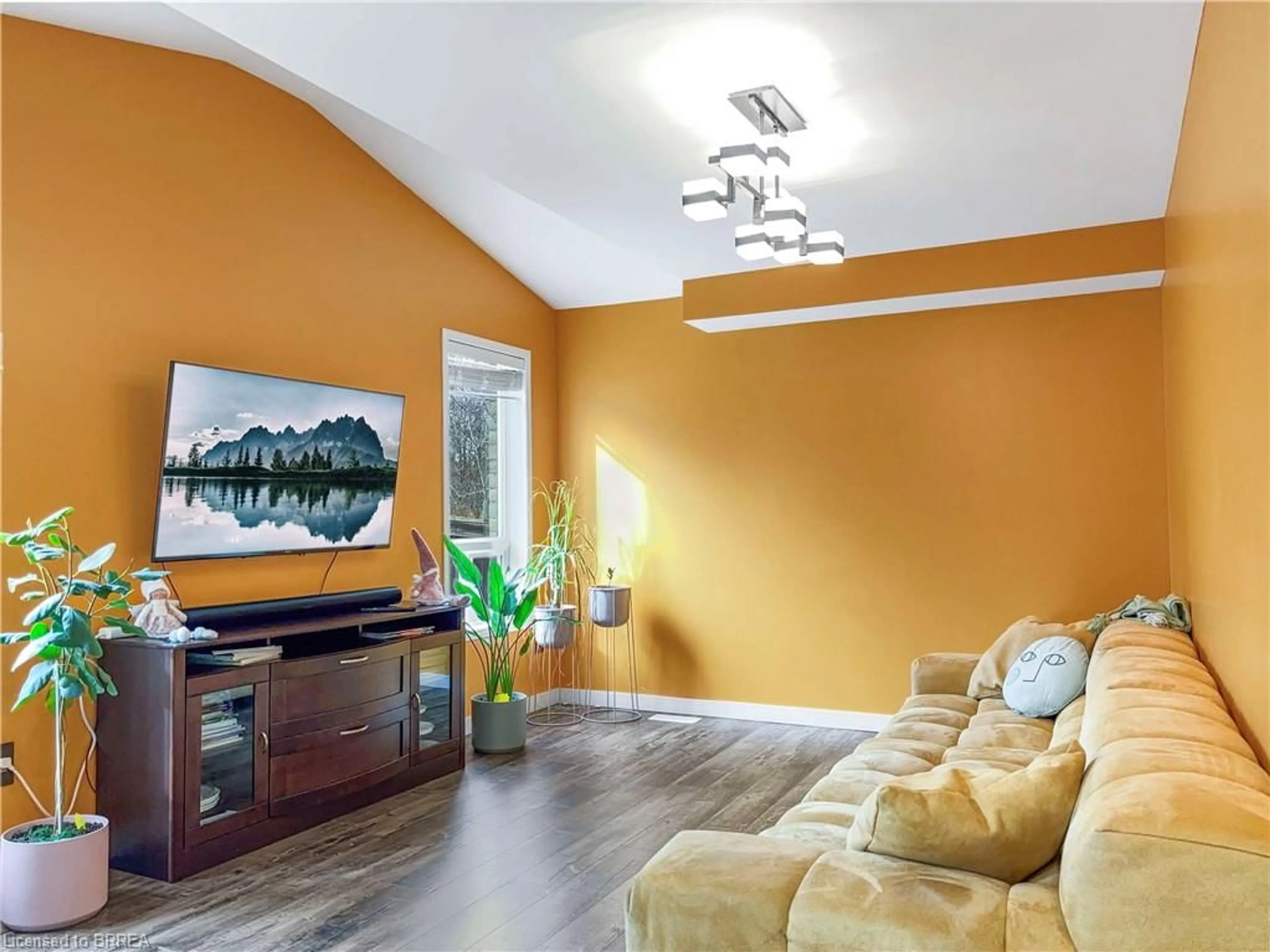 Living room with furniture, wood/laminate floor for 39 Barrett Ave, Brantford Ontario N3S 0B5