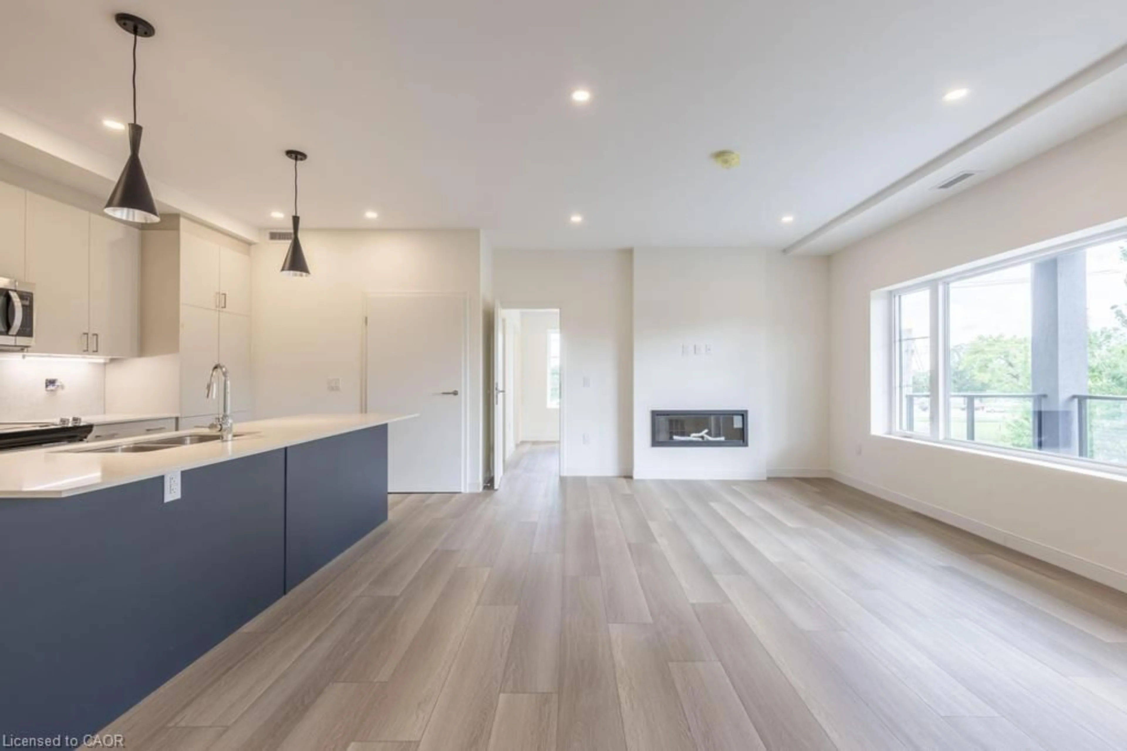 Open concept kitchen, wood/laminate floor for 119 Lincoln St #303, Welland Ontario L3C 0L2