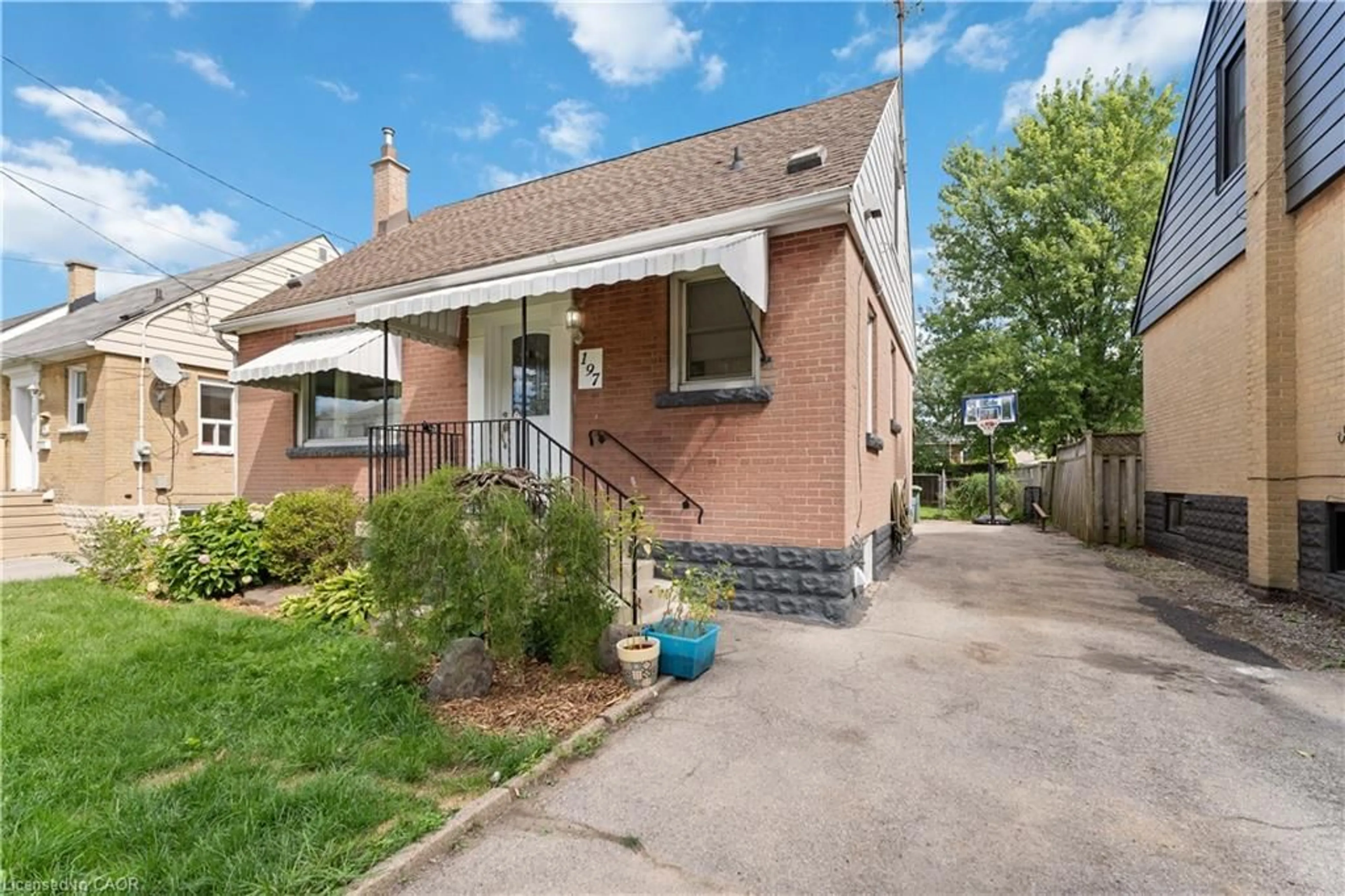 Home with brick exterior material, street for 197 East 12th St, Hamilton Ontario L9A 3X5