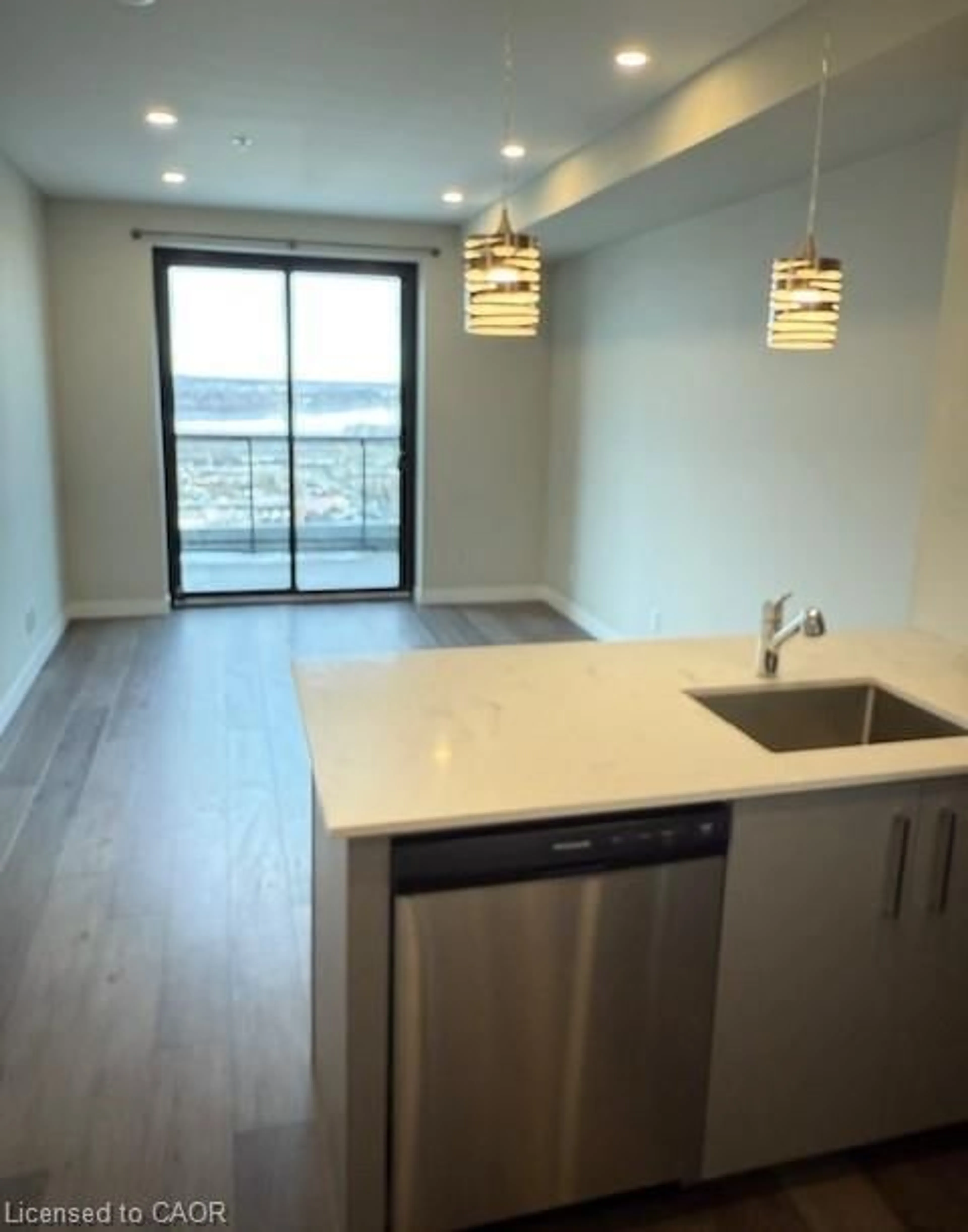 Open concept kitchen, wood/laminate floor for 15 Queen St #2308, Hamilton Ontario L8P 0C6