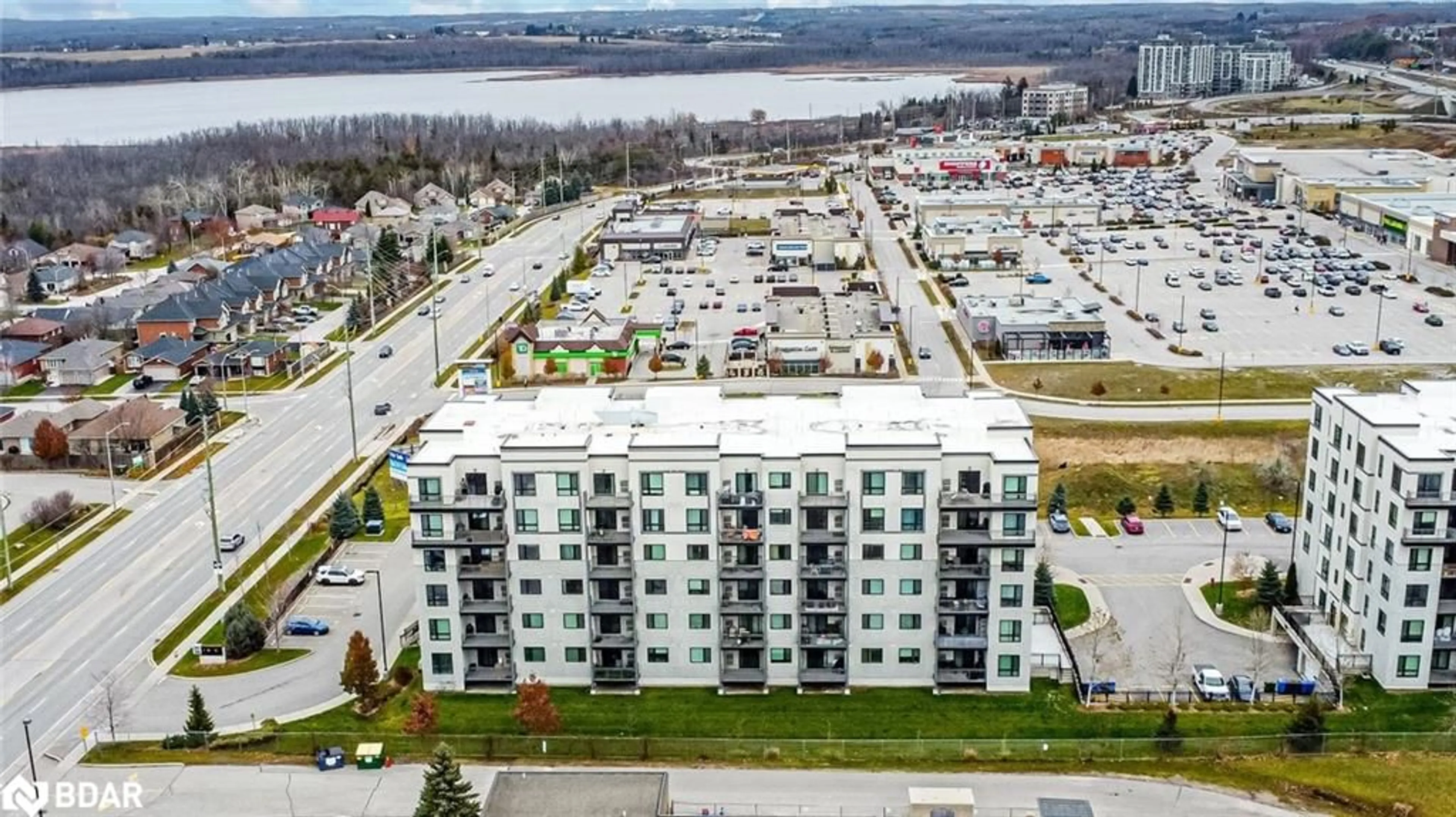 A pic from outside/outdoor area/front of a property/back of a property/a pic from drone, city buildings view from balcony for 295 Cundles Road East #404, Barrie Ontario L4M 0K8