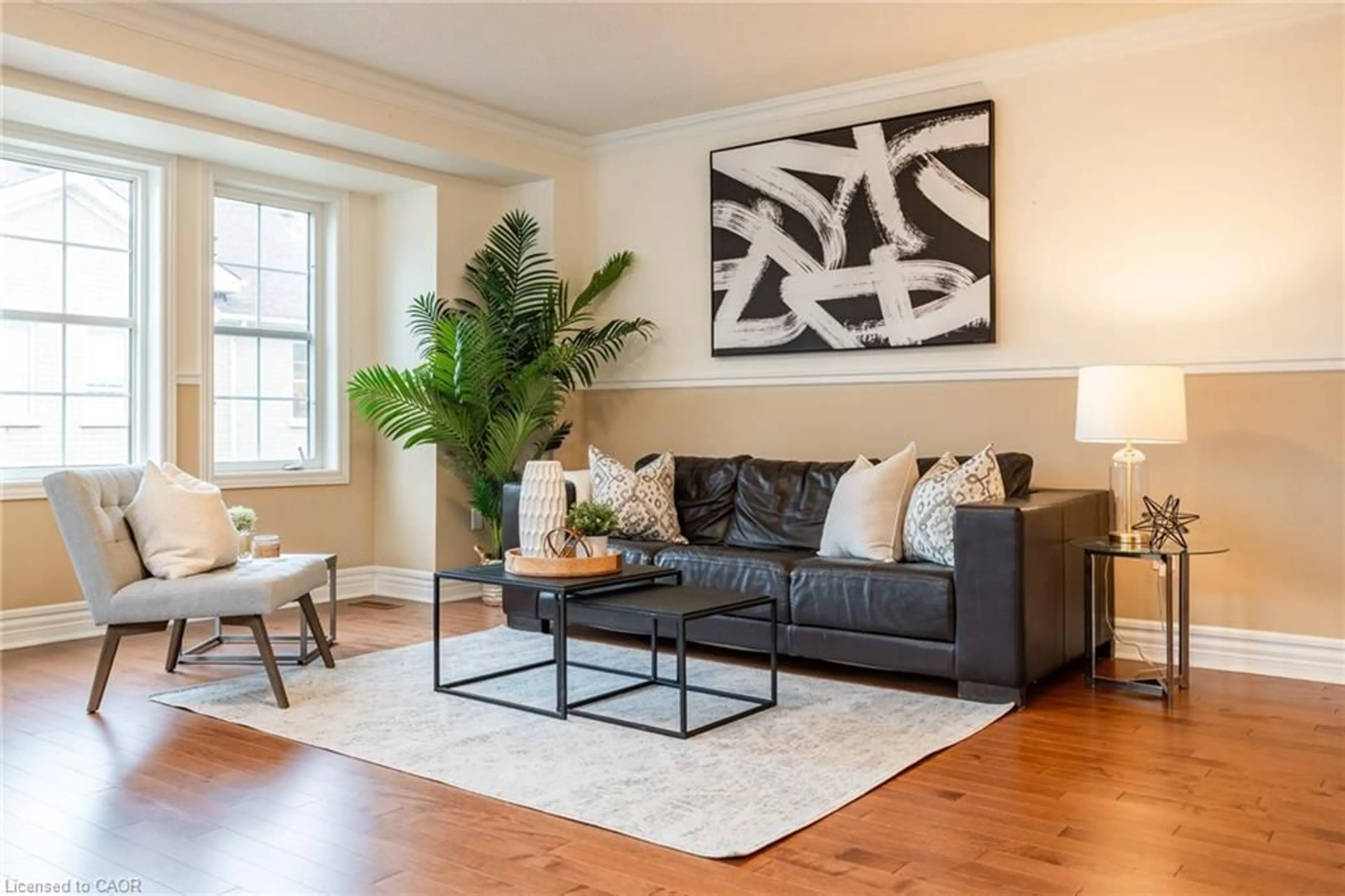 Living room with furniture, wood/laminate floor for 38 Archibald Mews, Toronto Ontario M1P 0A4