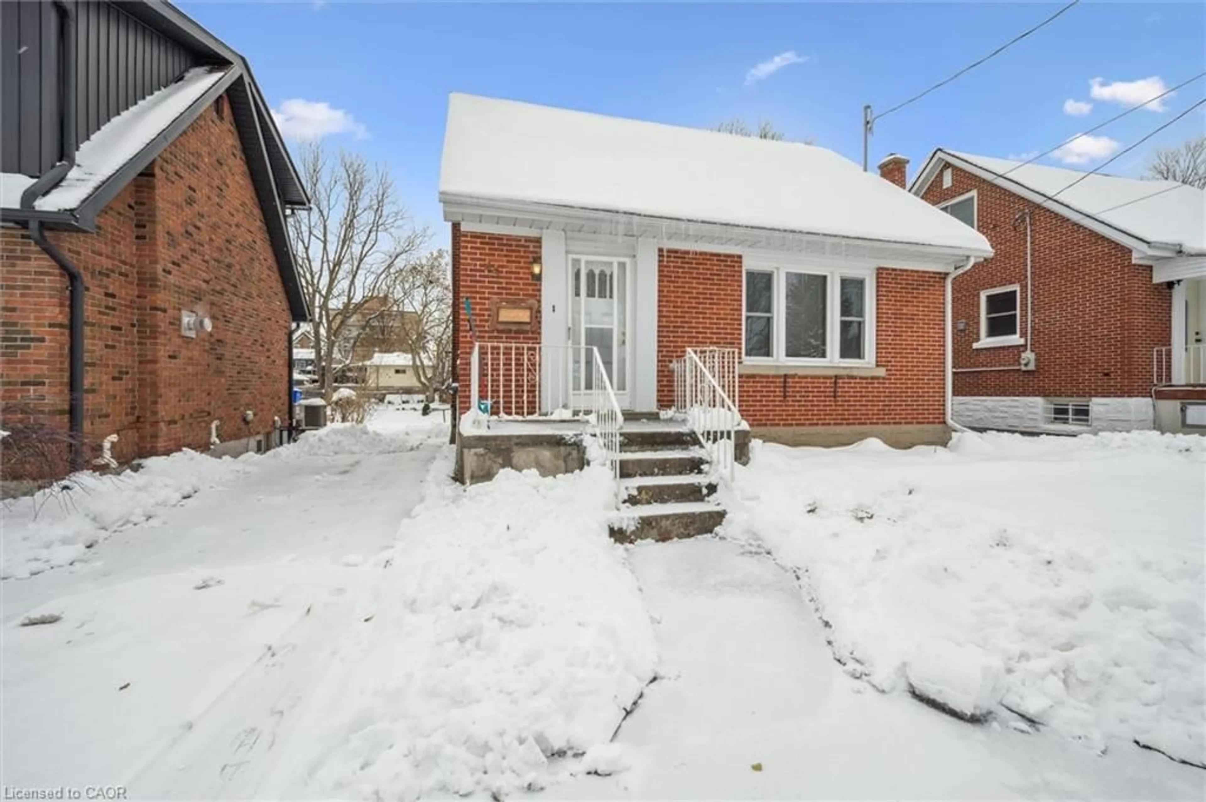 Home with brick exterior material, street for 45 Woodland Ave, Kitchener Ontario N2M 3G8