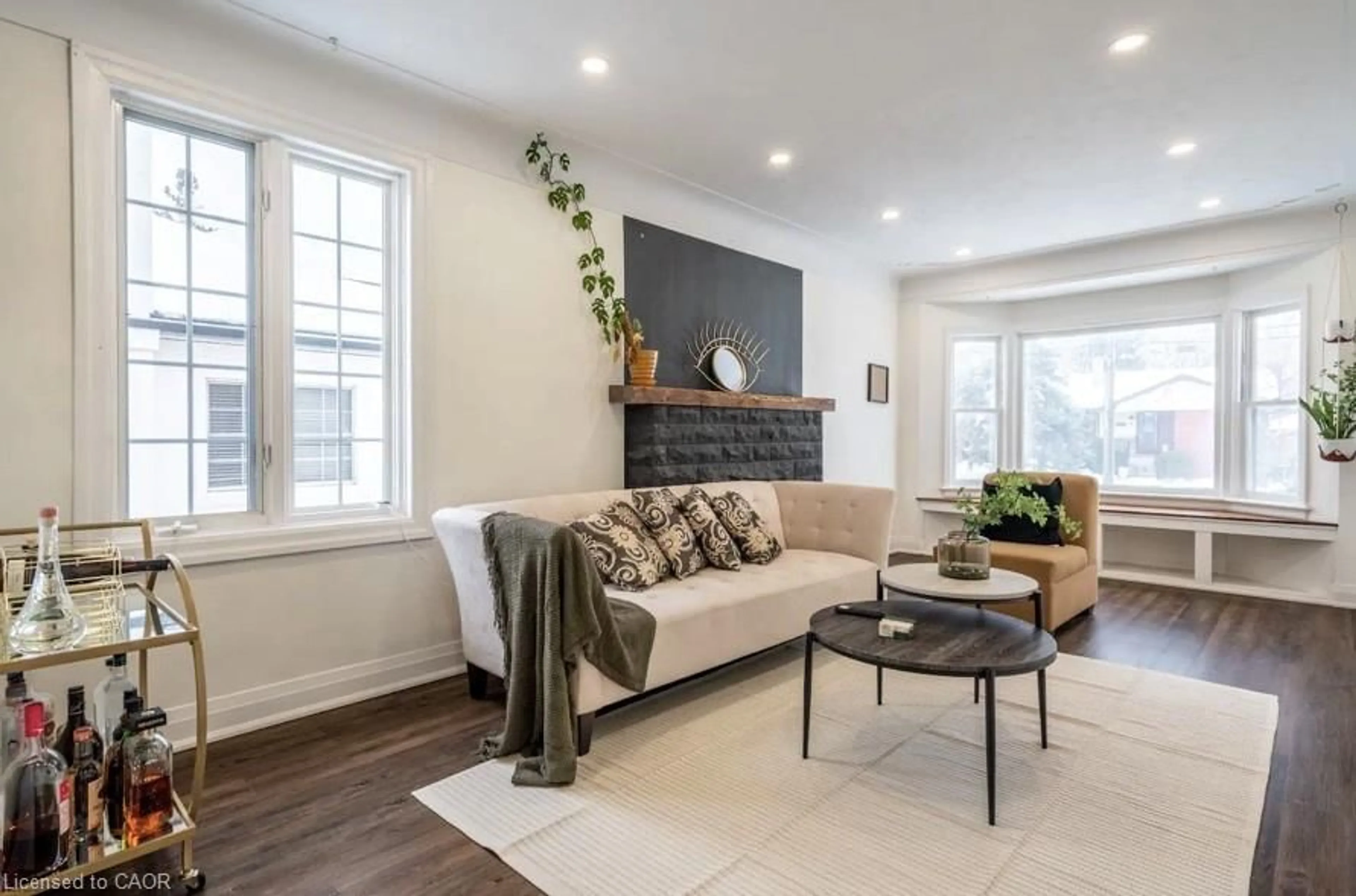 Living room with furniture, wood/laminate floor for 122 Queensdale Ave, Hamilton Ontario L9A 1K3