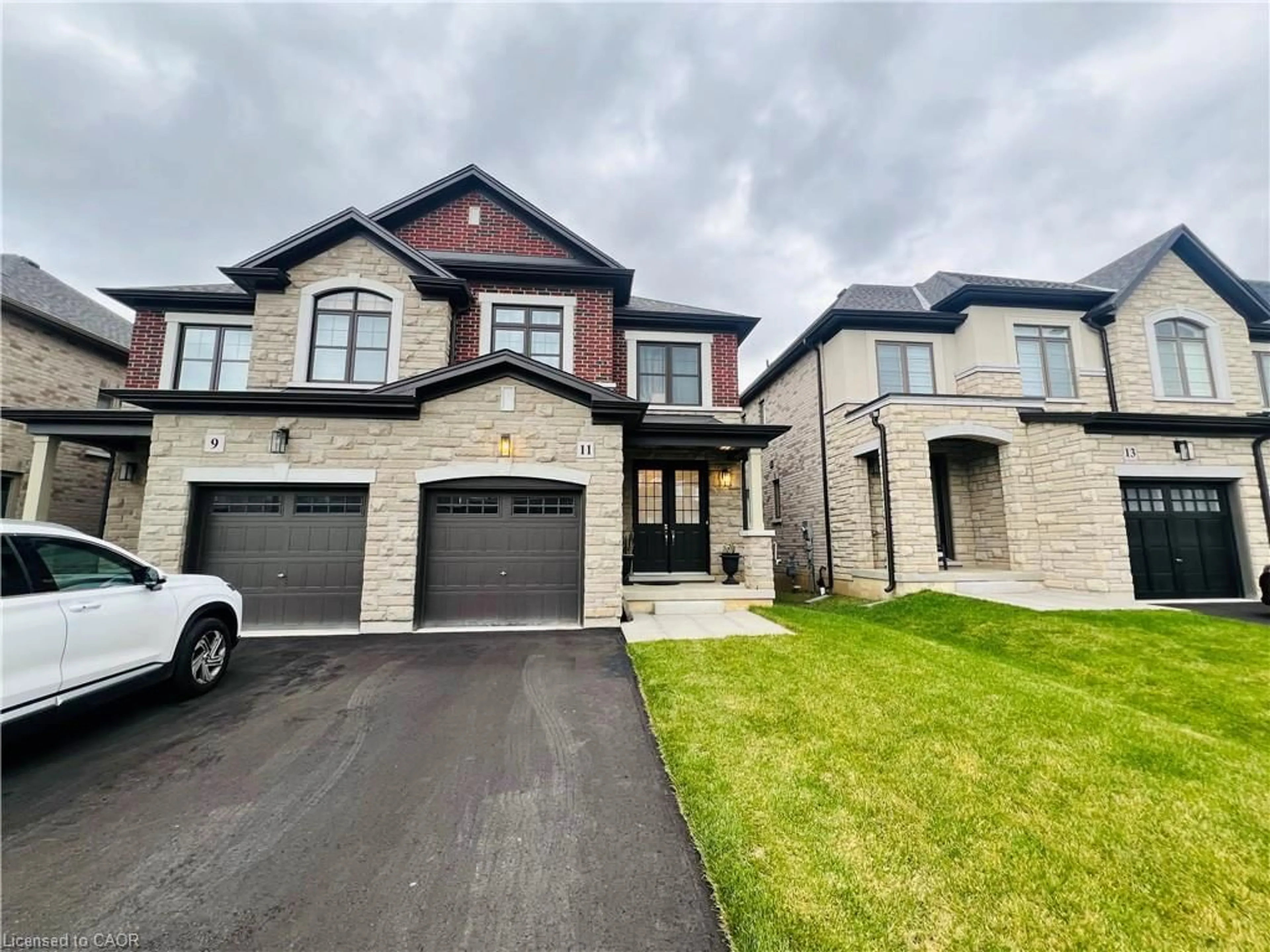 Home with brick exterior material, street for 11 Cherry Blossom Hts, Hamilton Ontario L9B 0E9