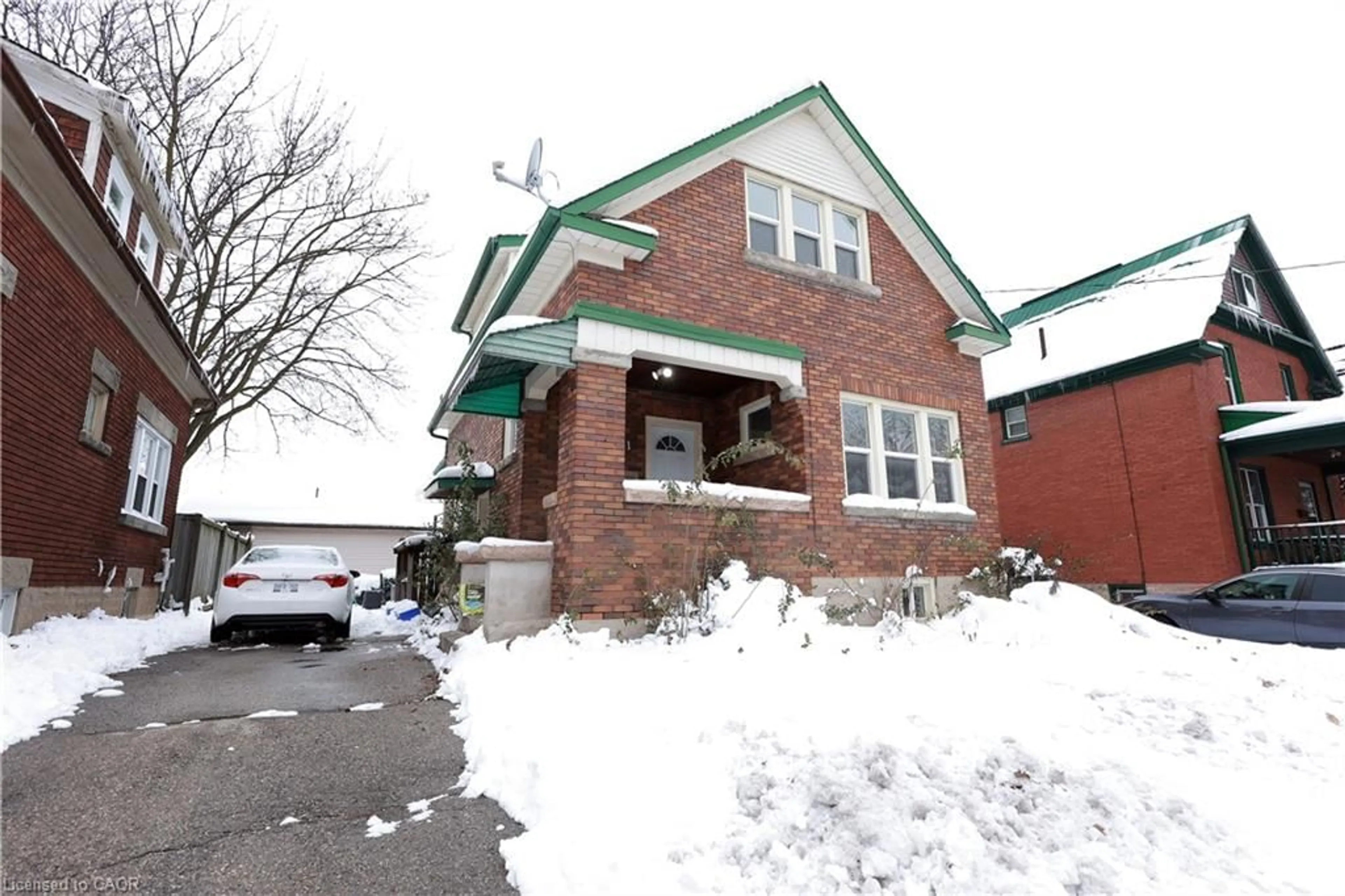 Home with brick exterior material, street for 21 Peppler St, Waterloo Ontario N2J 3C3