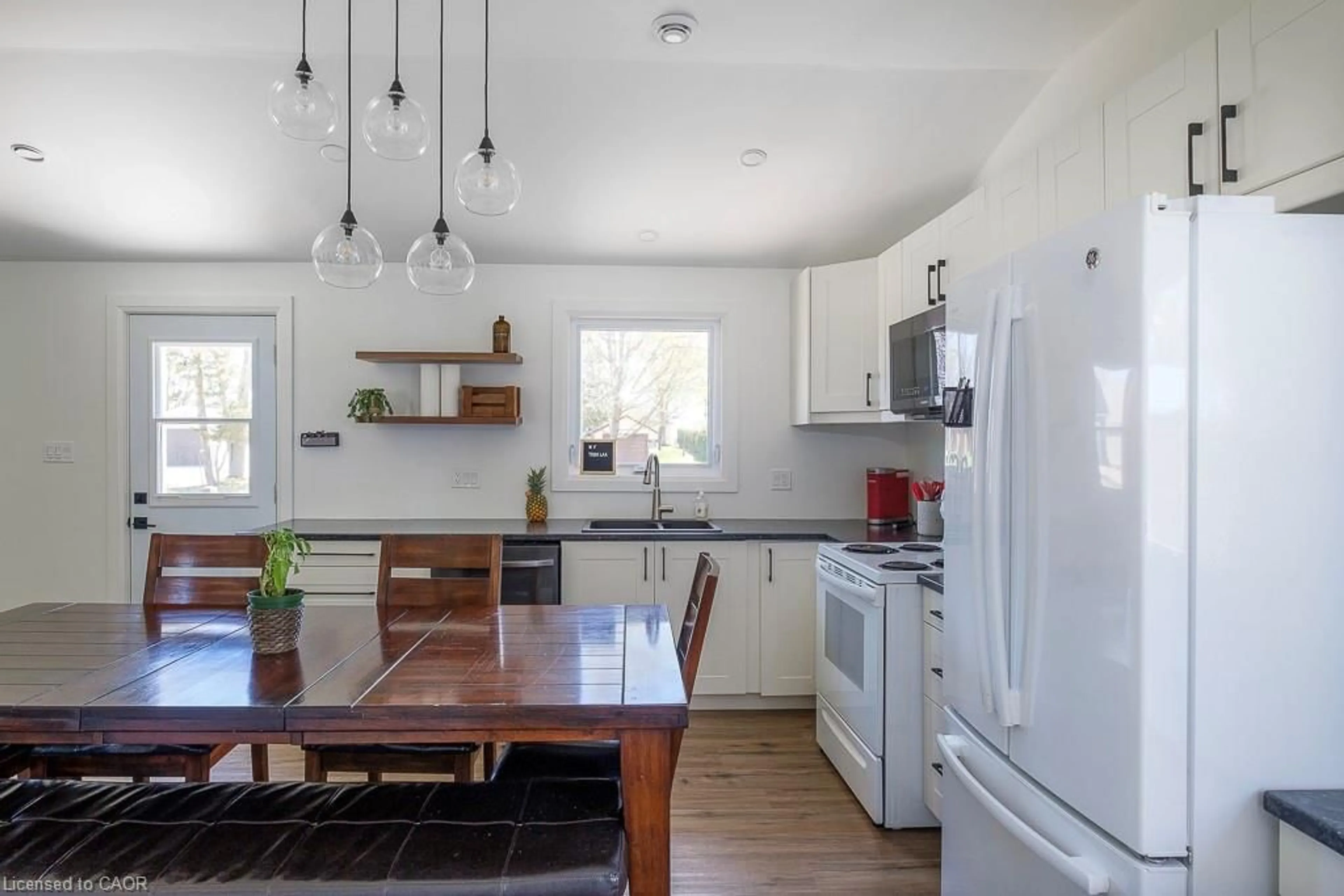 Open concept kitchen, wood/laminate floor for 197 Cedar Dr, Turkey Point Ontario N0E 1T0