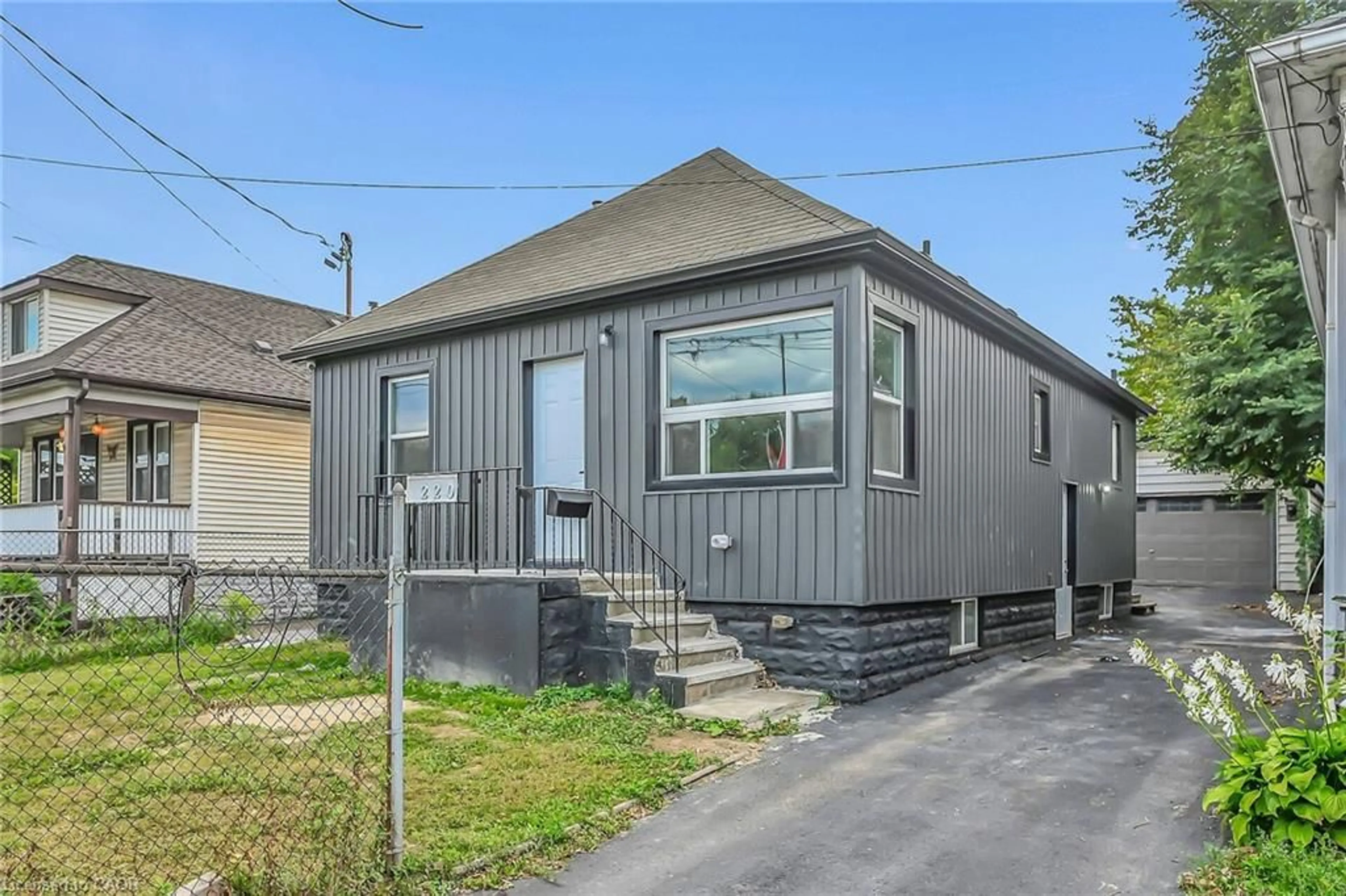 Home with vinyl exterior material, street for 220 Grenfell St, Hamilton Ontario L8H 3J7