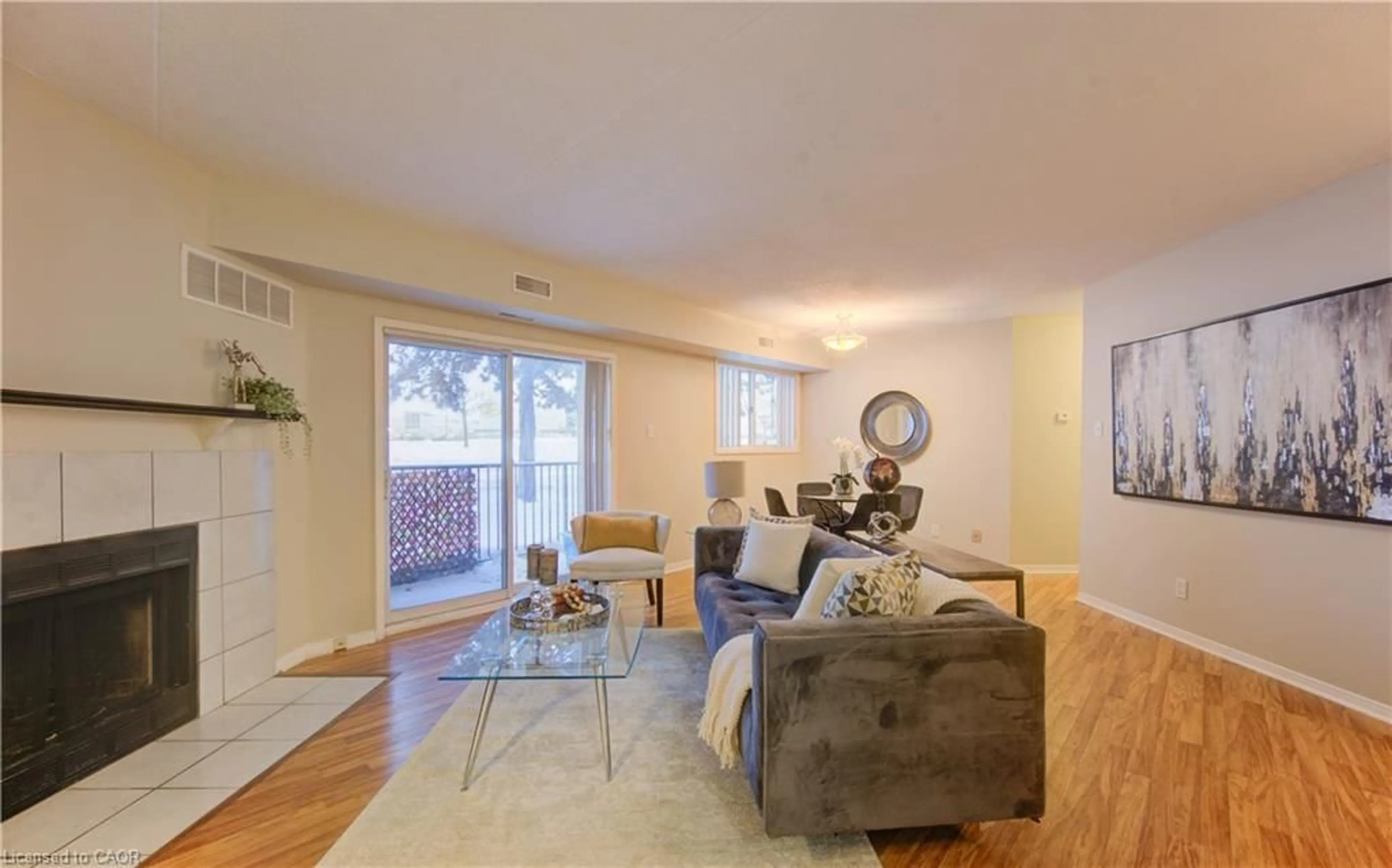 Living room with furniture, wood/laminate floor for 3085 Kingsway Dr #50, Kitchener Ontario N2C 2P2