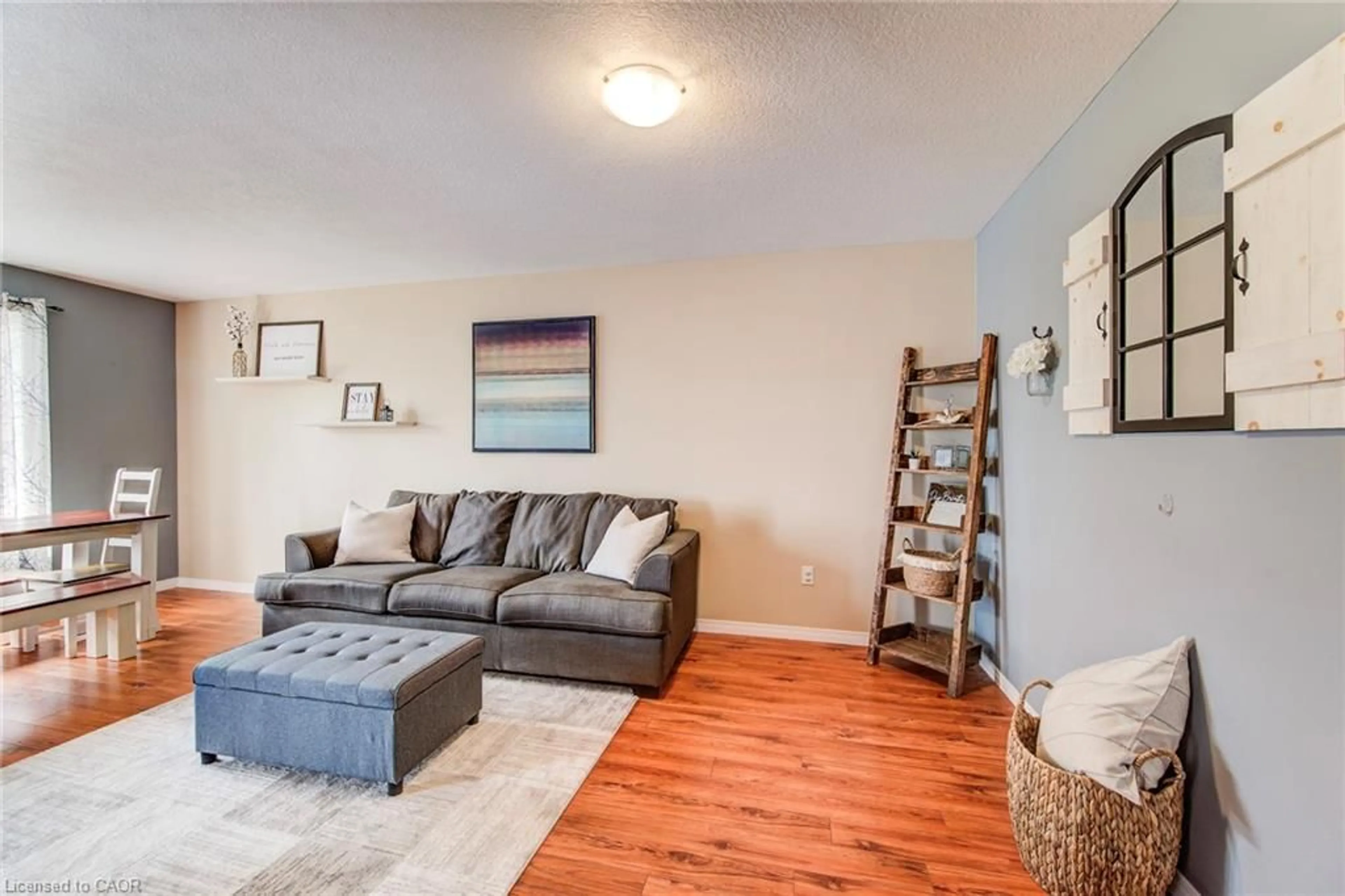 Living room with furniture, wood/laminate floor for 137 Liebler St, Tavistock Ontario N0B 2R0