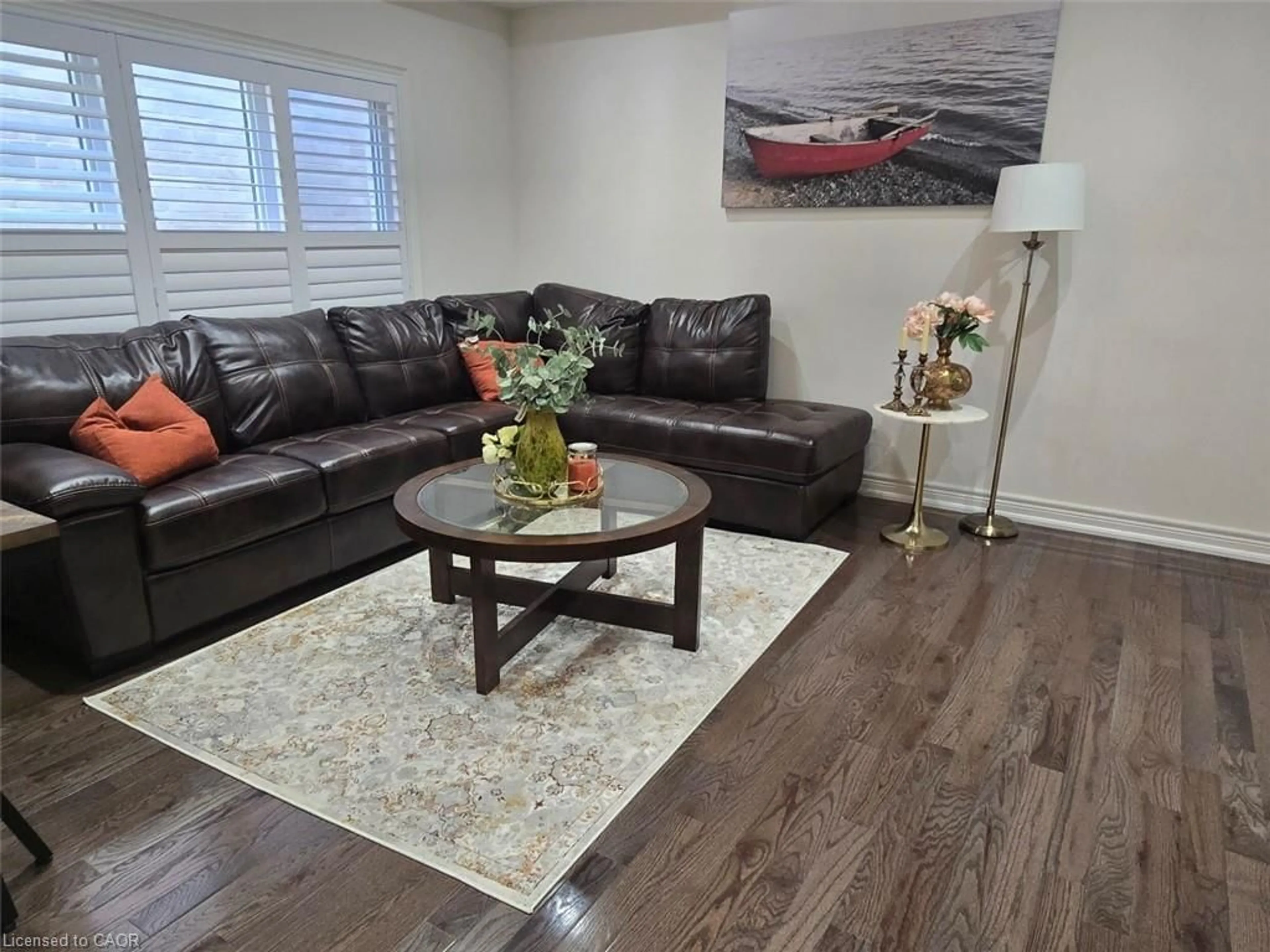 Living room with furniture, wood/laminate floor for 77 Eaglecrest St, Kitchener Ontario N2K 4K1