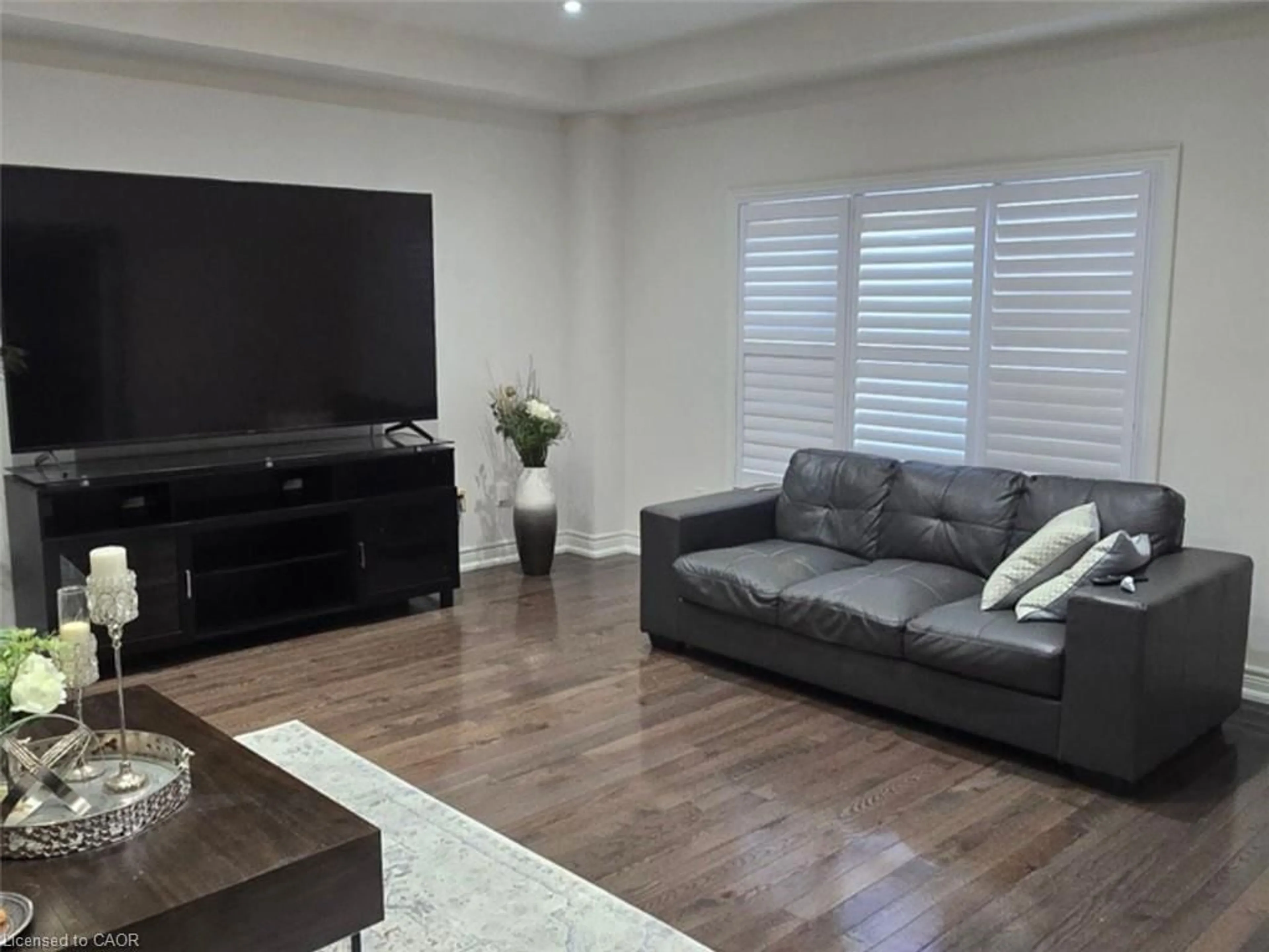 Living room with furniture, wood/laminate floor for 77 Eaglecrest St, Kitchener Ontario N2K 4K1