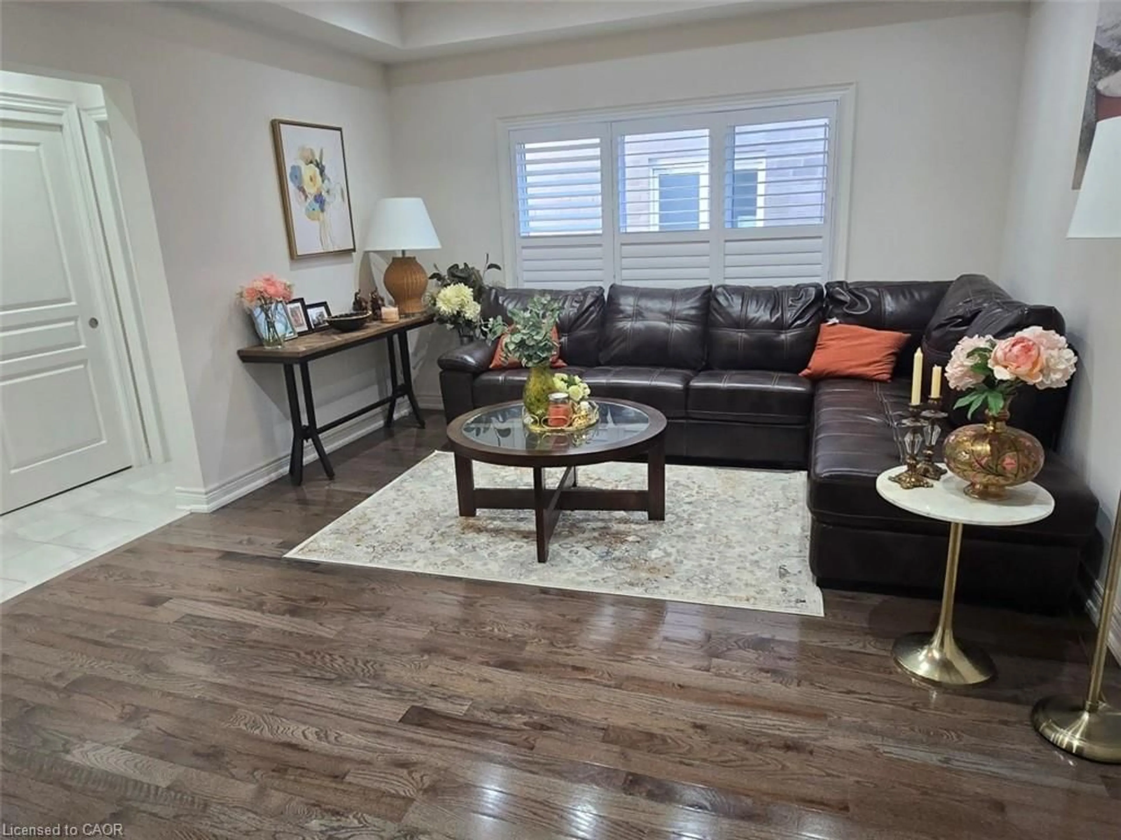 Living room with furniture, wood/laminate floor for 77 Eaglecrest St, Kitchener Ontario N2K 4K1