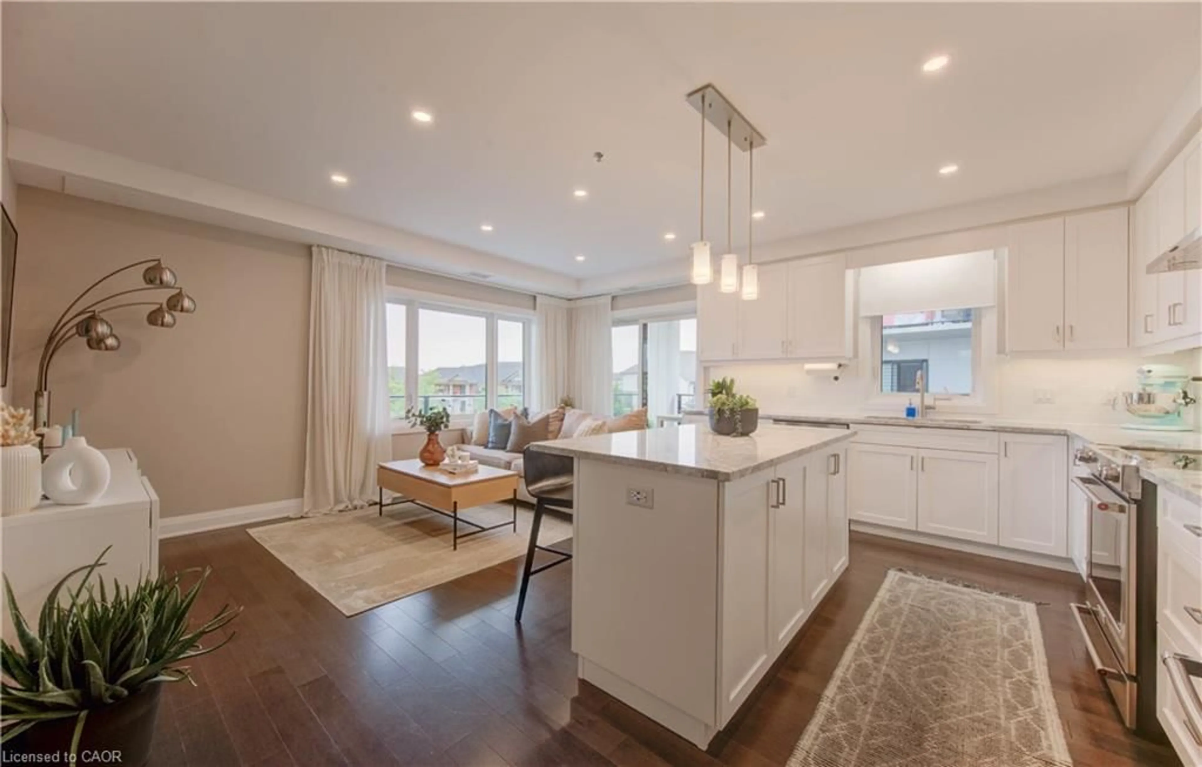 Open concept kitchen, wood/laminate floor for 249 Grey Silo Rd #202, Waterloo Ontario N2K 0G8