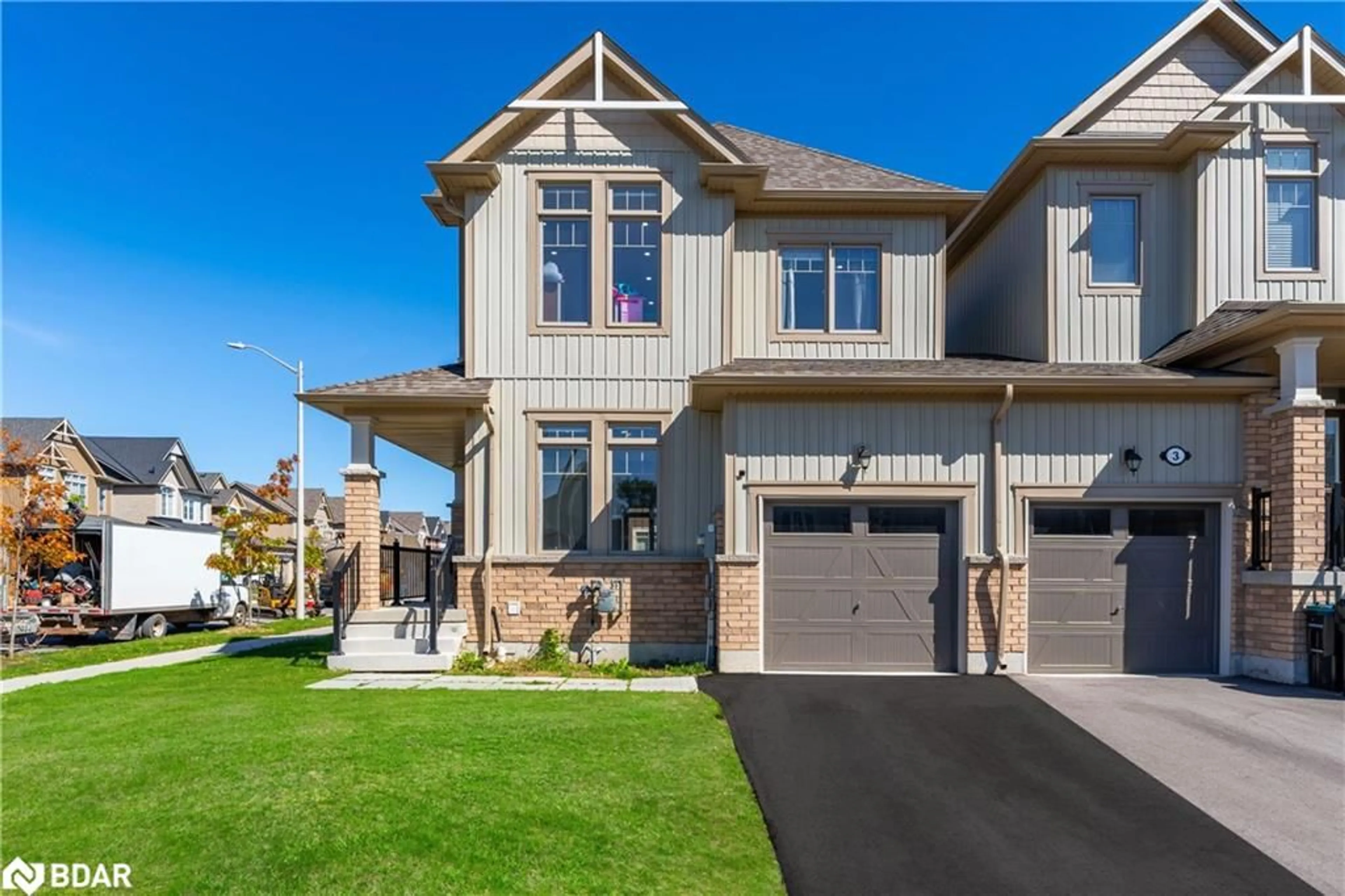 Home with brick exterior material, street for 58 Tracey Lane, Collingwood Ontario L9Y 3V2