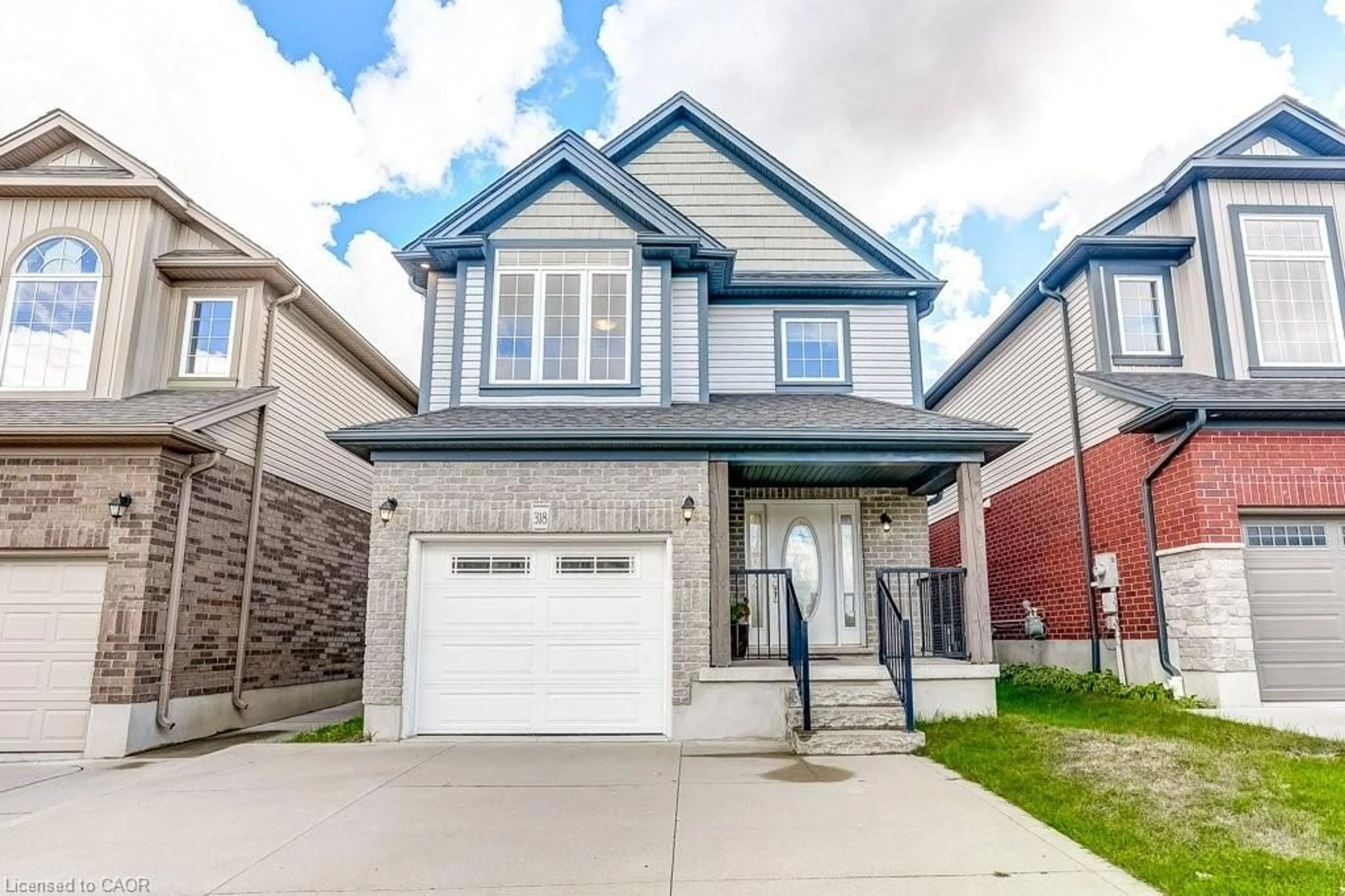 Home with brick exterior material, street for 318 Old Huron Rd, Kitchener Ontario N2R 1P8