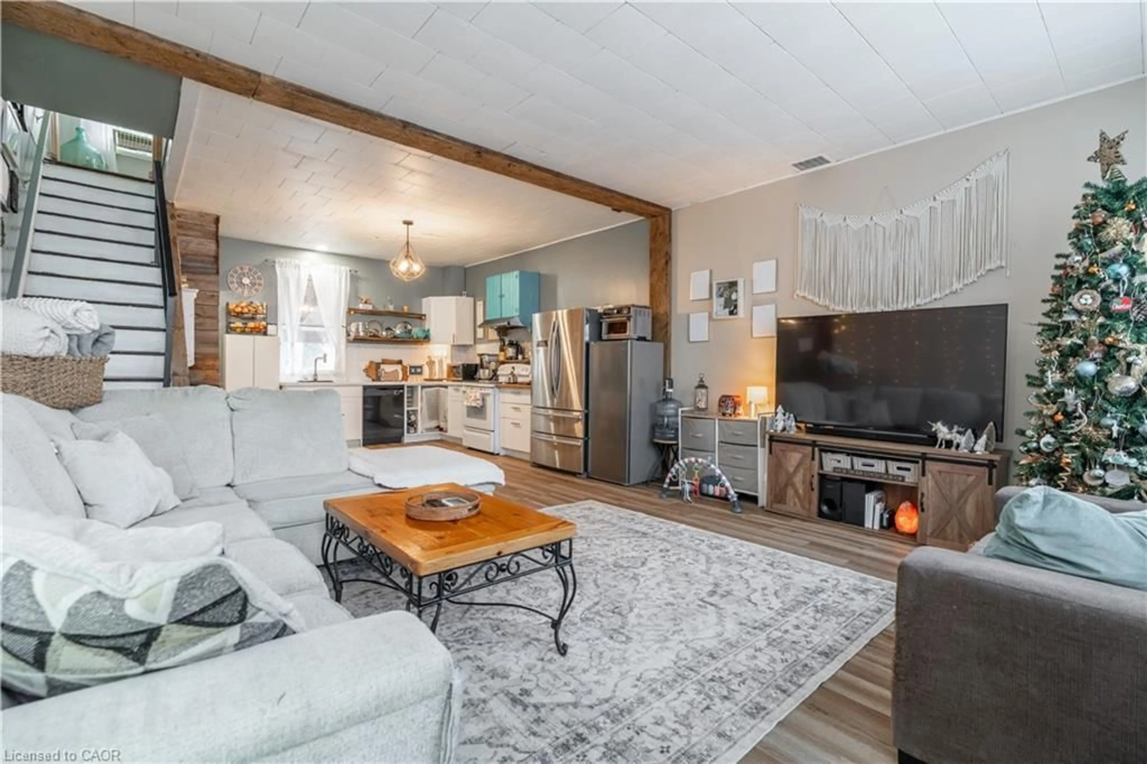 Living room with furniture, wood/laminate floor for 18 King St #A&B, Cayuga Ontario N0A 1E0