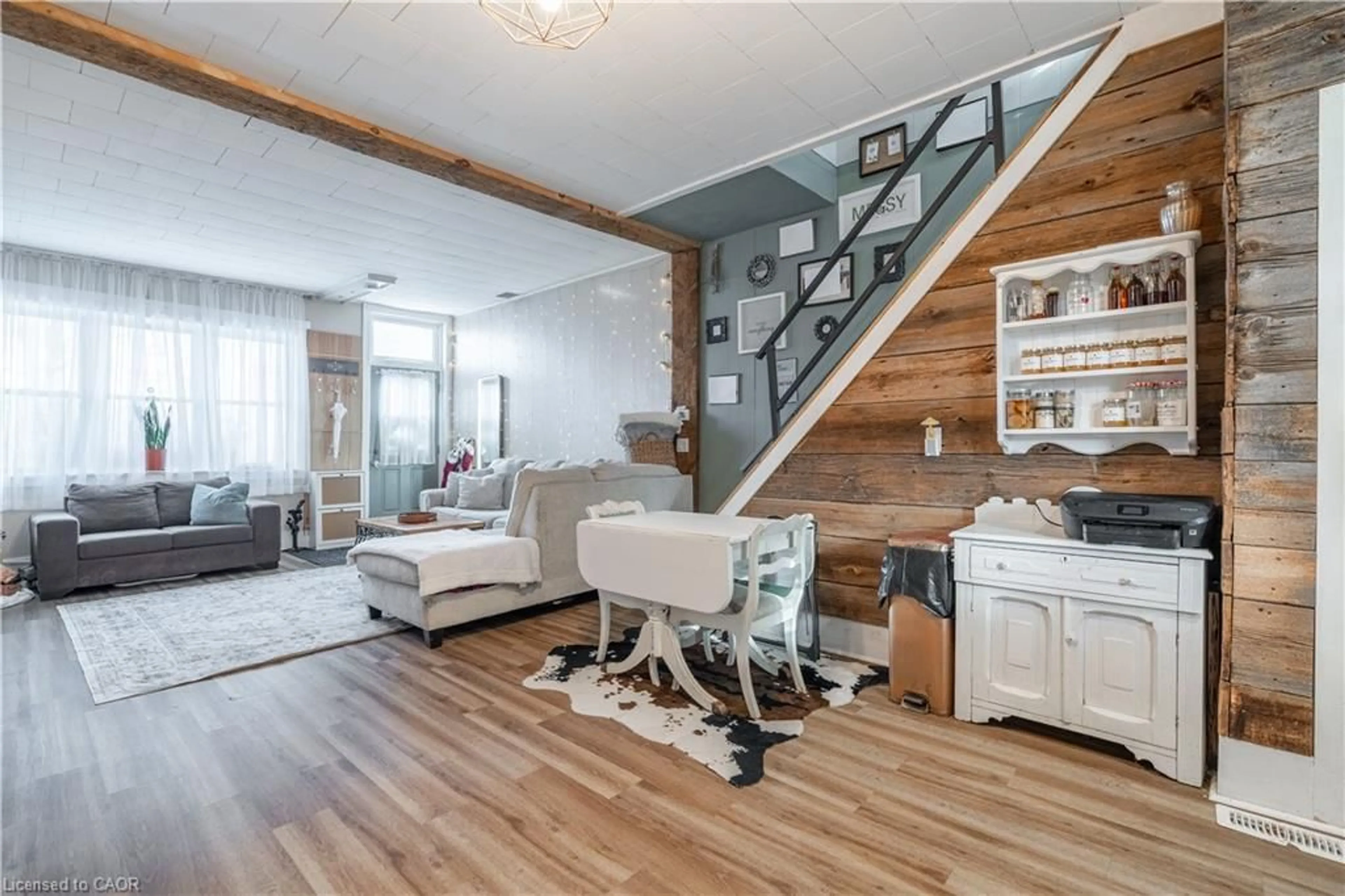 Living room with furniture, wood/laminate floor for 18 King St #A&B, Cayuga Ontario N0A 1E0