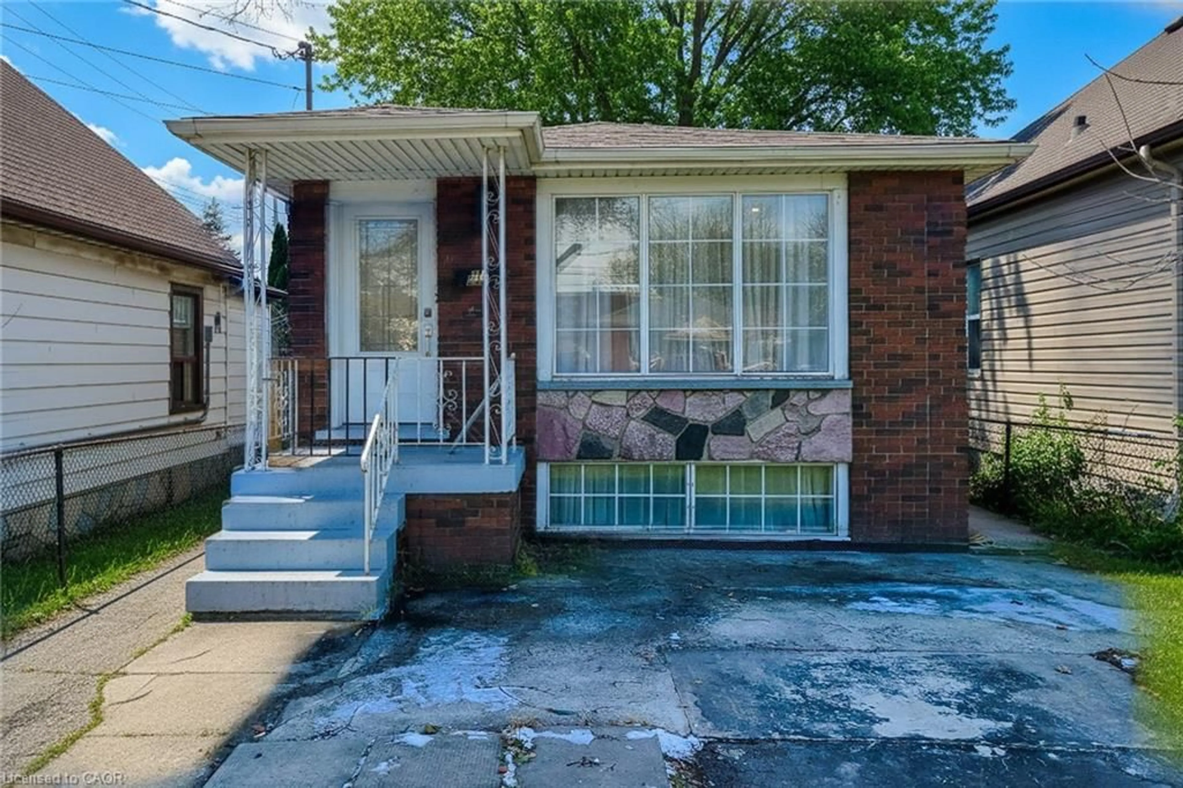 Home with brick exterior material, street for 212 Grace Ave, Hamilton Ontario L8H 3X3