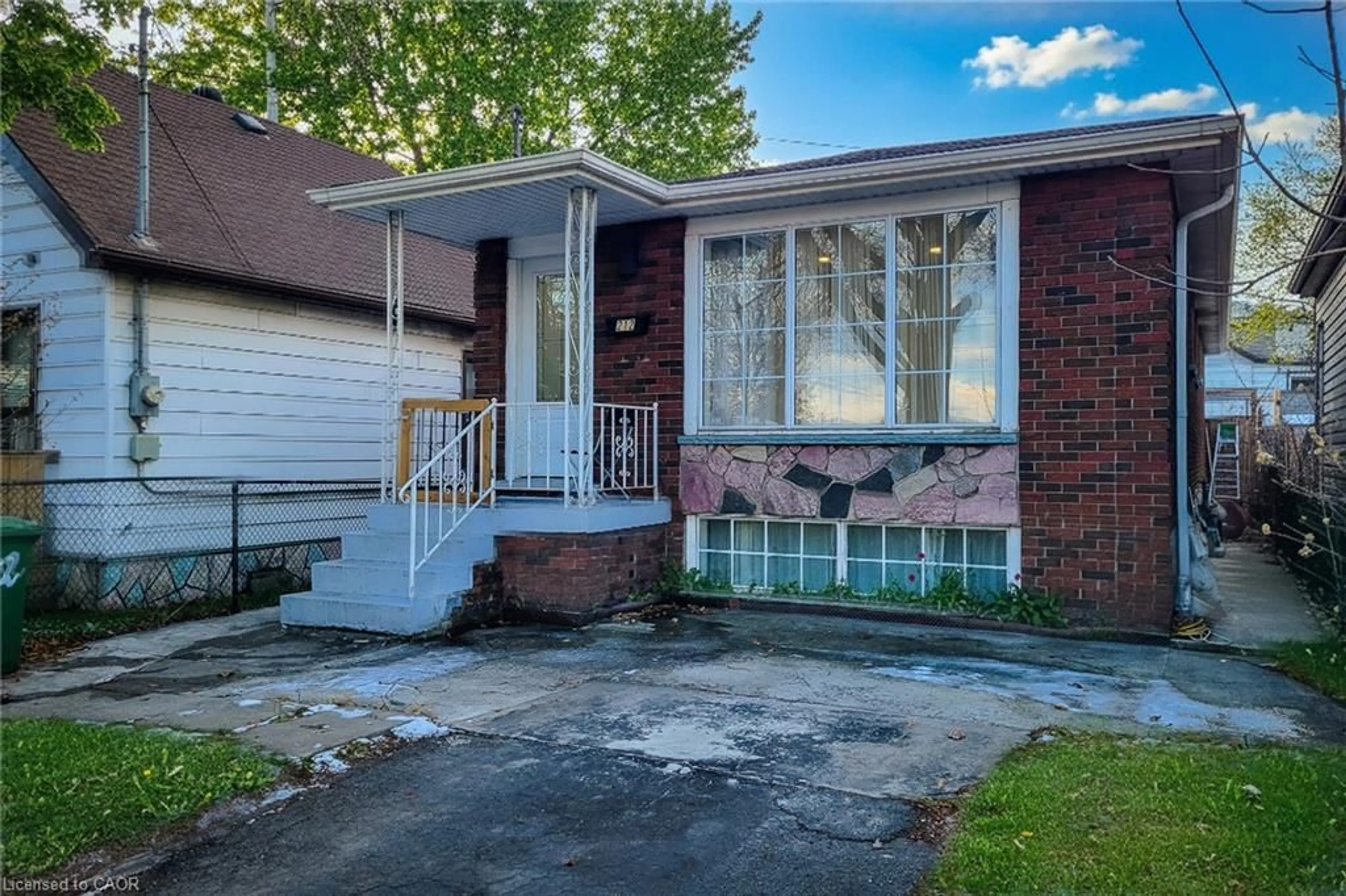 Home with brick exterior material, street for 212 Grace Ave, Hamilton Ontario L8H 3X3