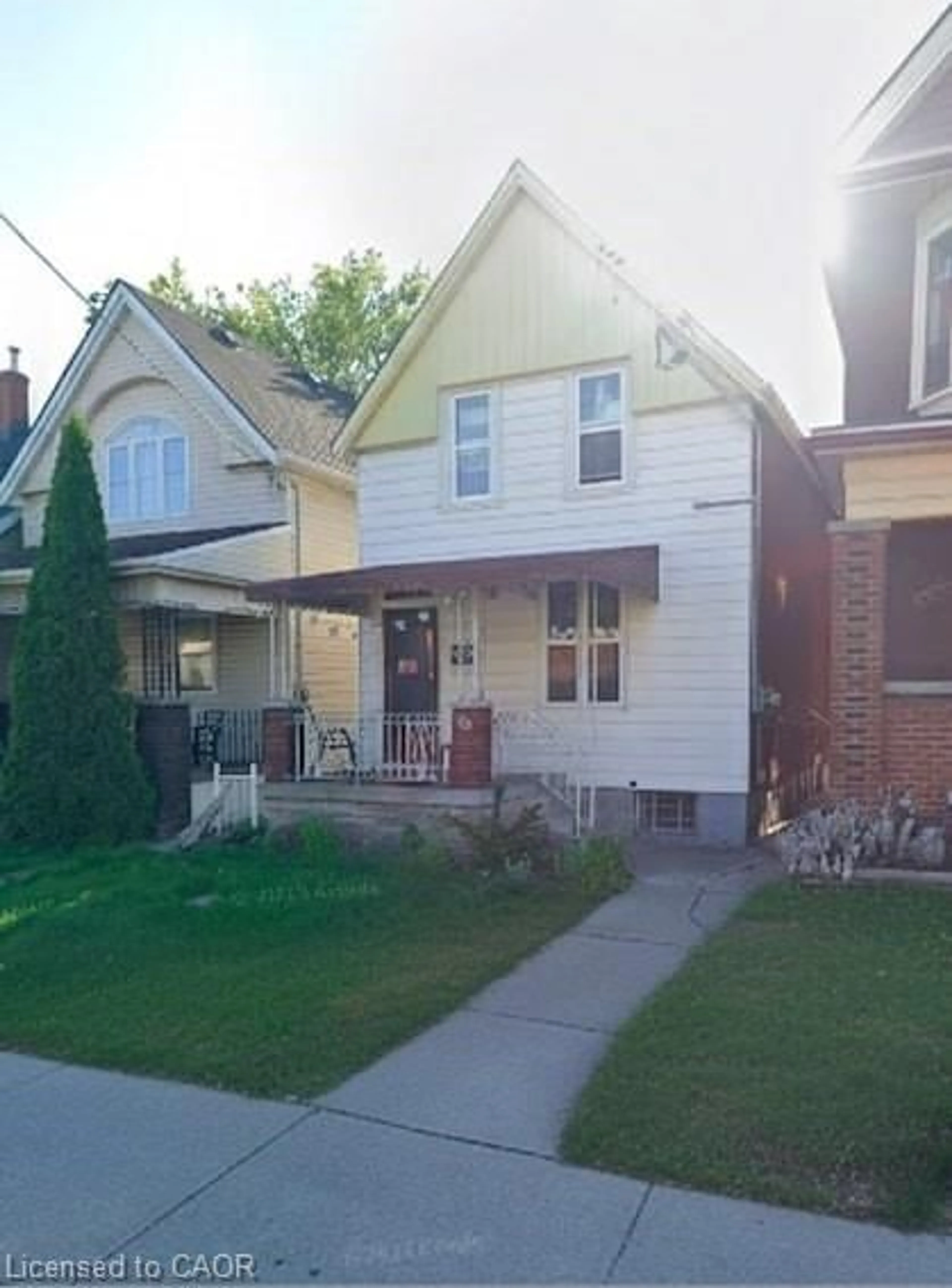 Home with vinyl exterior material, street for 100 Sherman Ave, Hamilton Ontario L8L 6M5