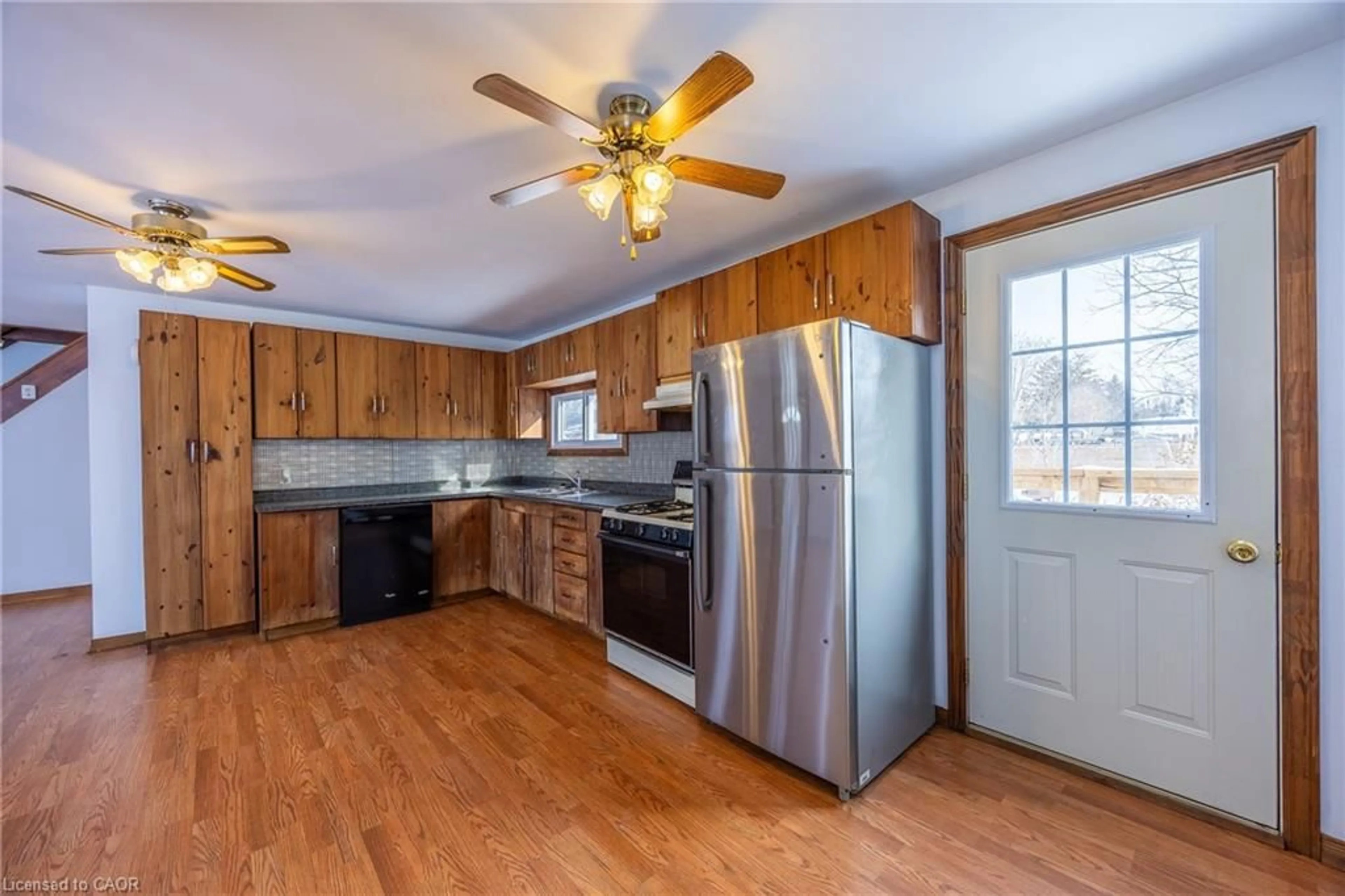 Open concept kitchen, wood/laminate floor for 110 Nelson St, Port Dover Ontario N0A 1N0