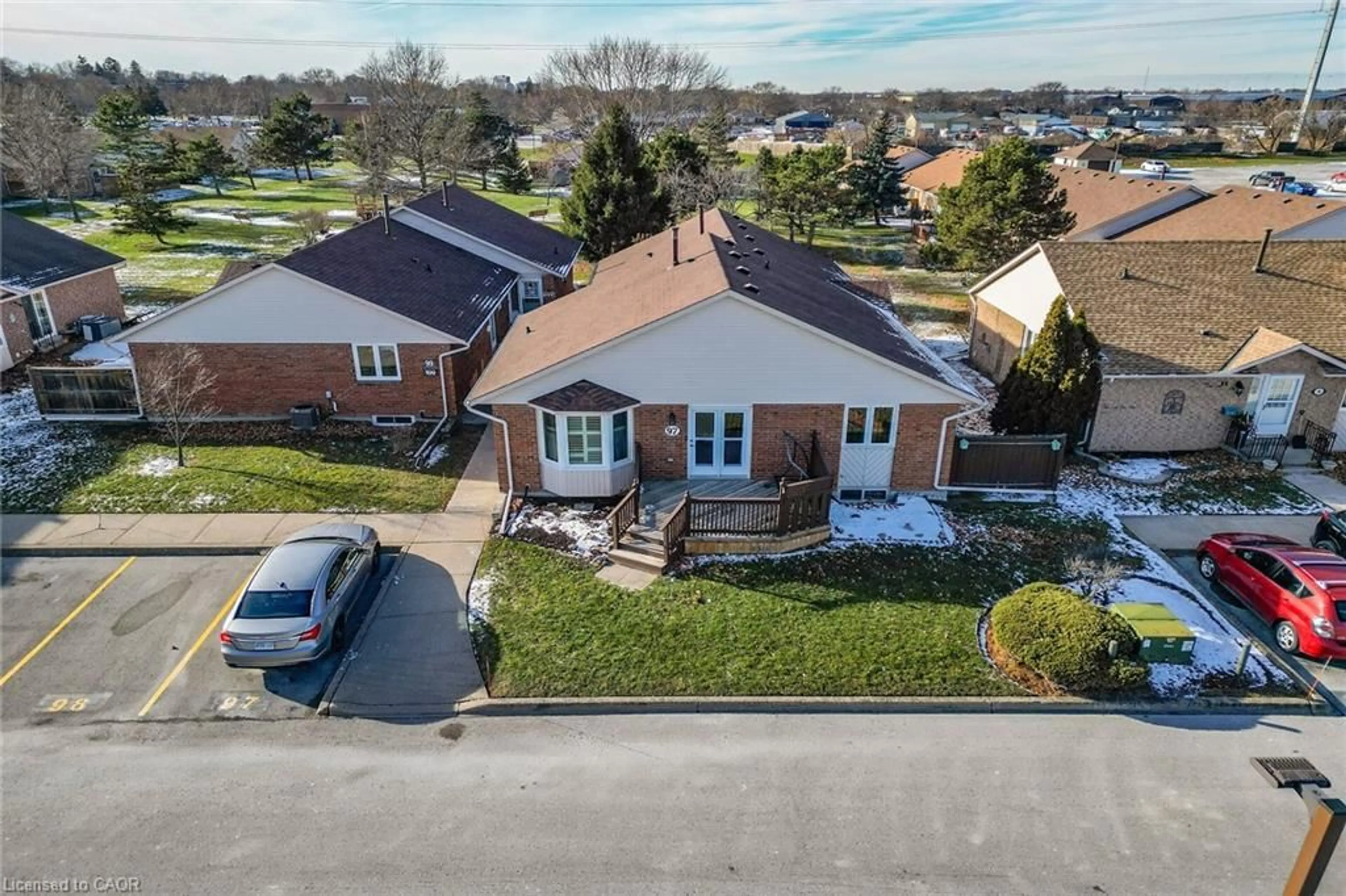 A pic from outside/outdoor area/front of a property/back of a property/a pic from drone, street for 122 Bunting Rd #97, St. Catharines Ontario L2P 3X7