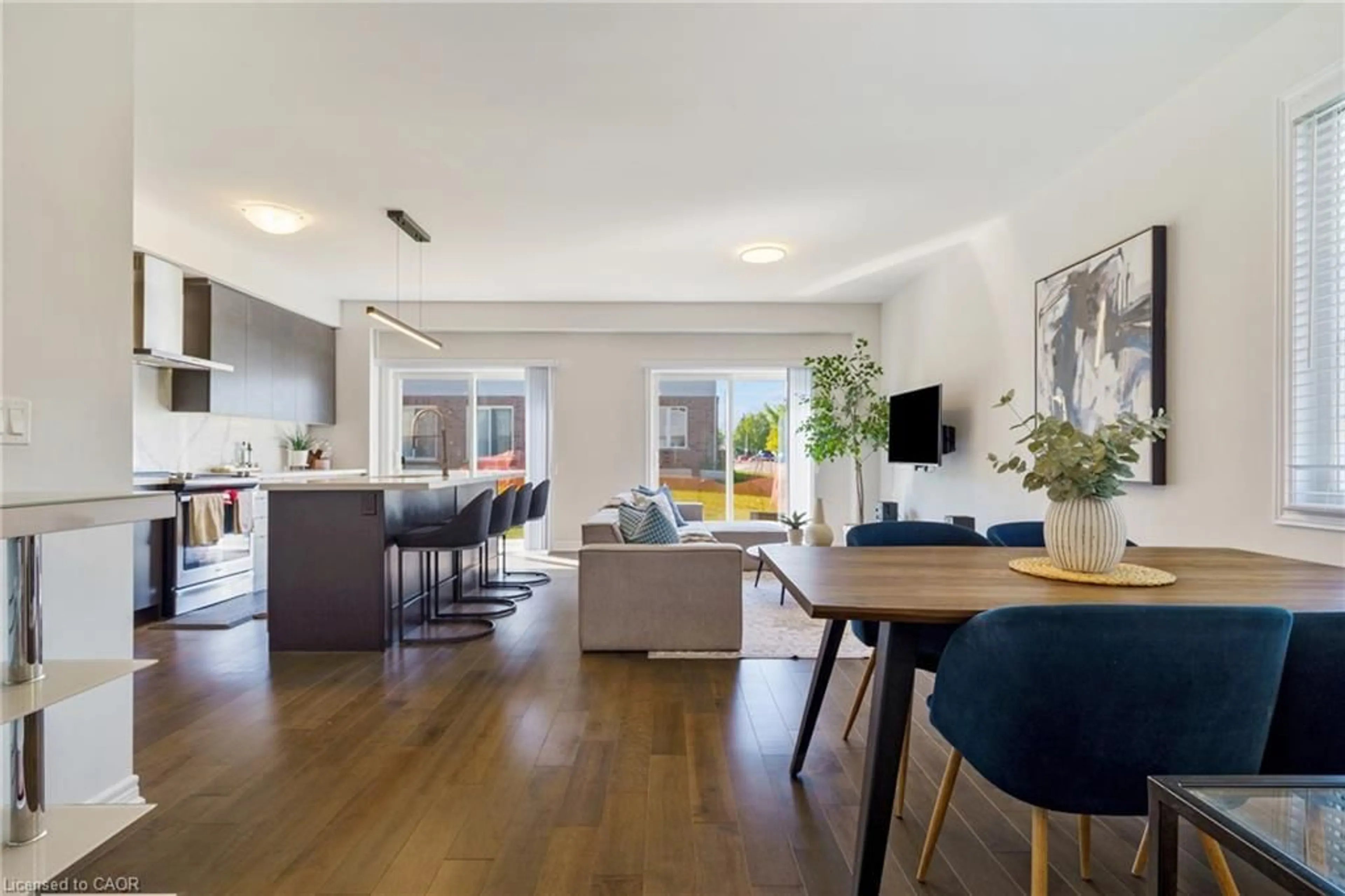 Living room with furniture, wood/laminate floor for 60 Bobolink St, Hamilton Ontario L9A 2P5