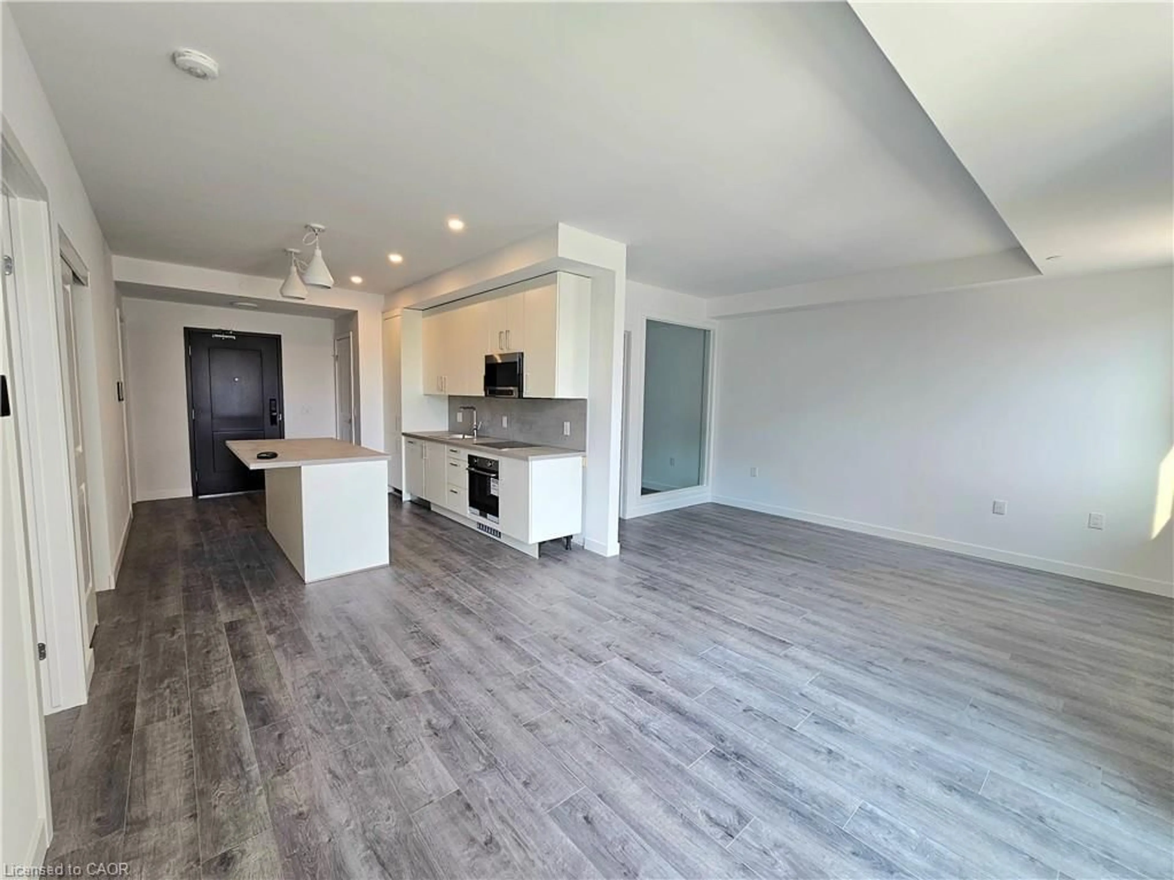 Open concept kitchen, wood/laminate floor for 7549A Kalar Rd #214, Niagara Falls Ontario L2H 3W6