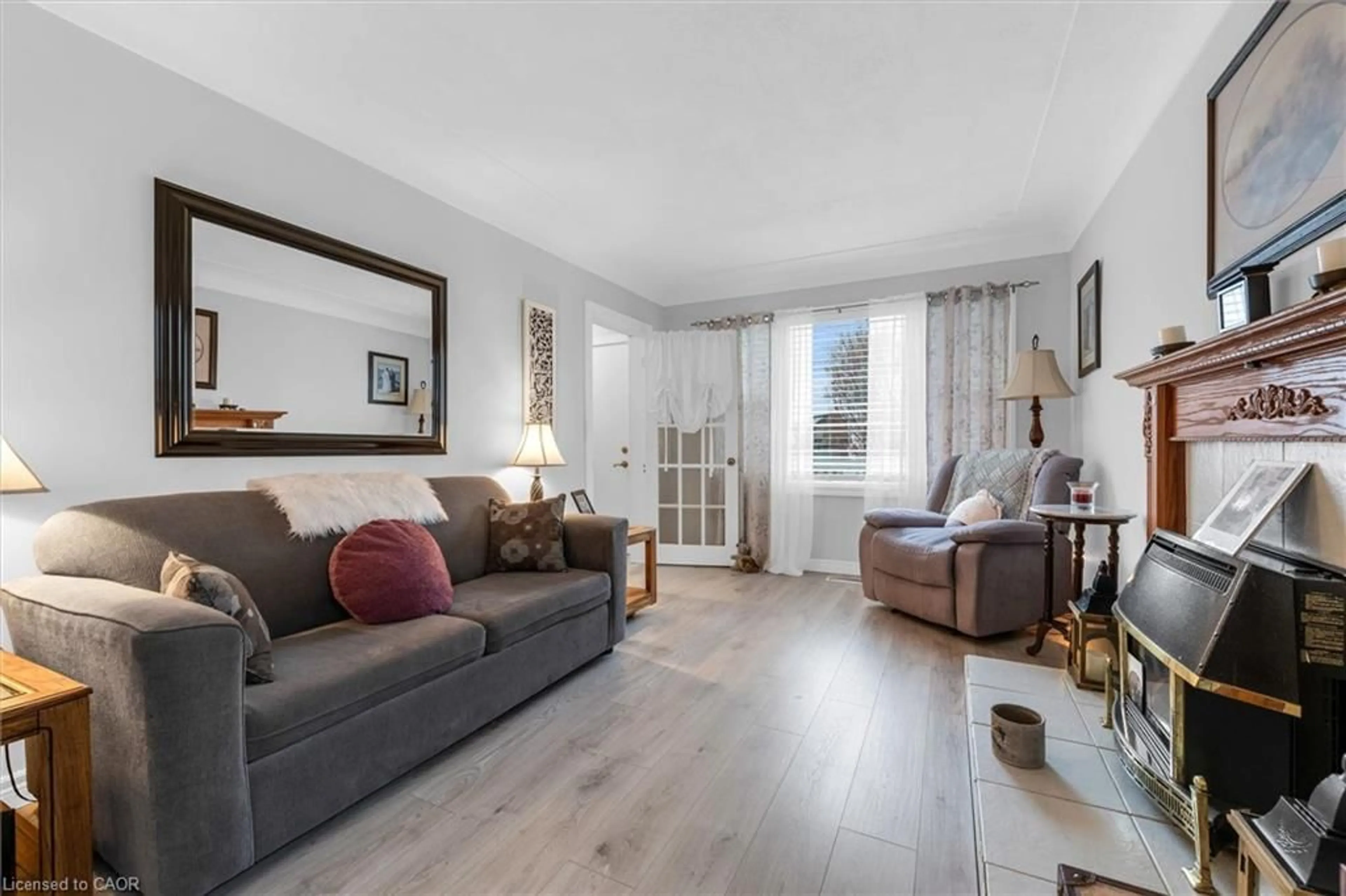 Living room with furniture, wood/laminate floor for 143 Walter Ave, Hamilton Ontario L8K 3K8