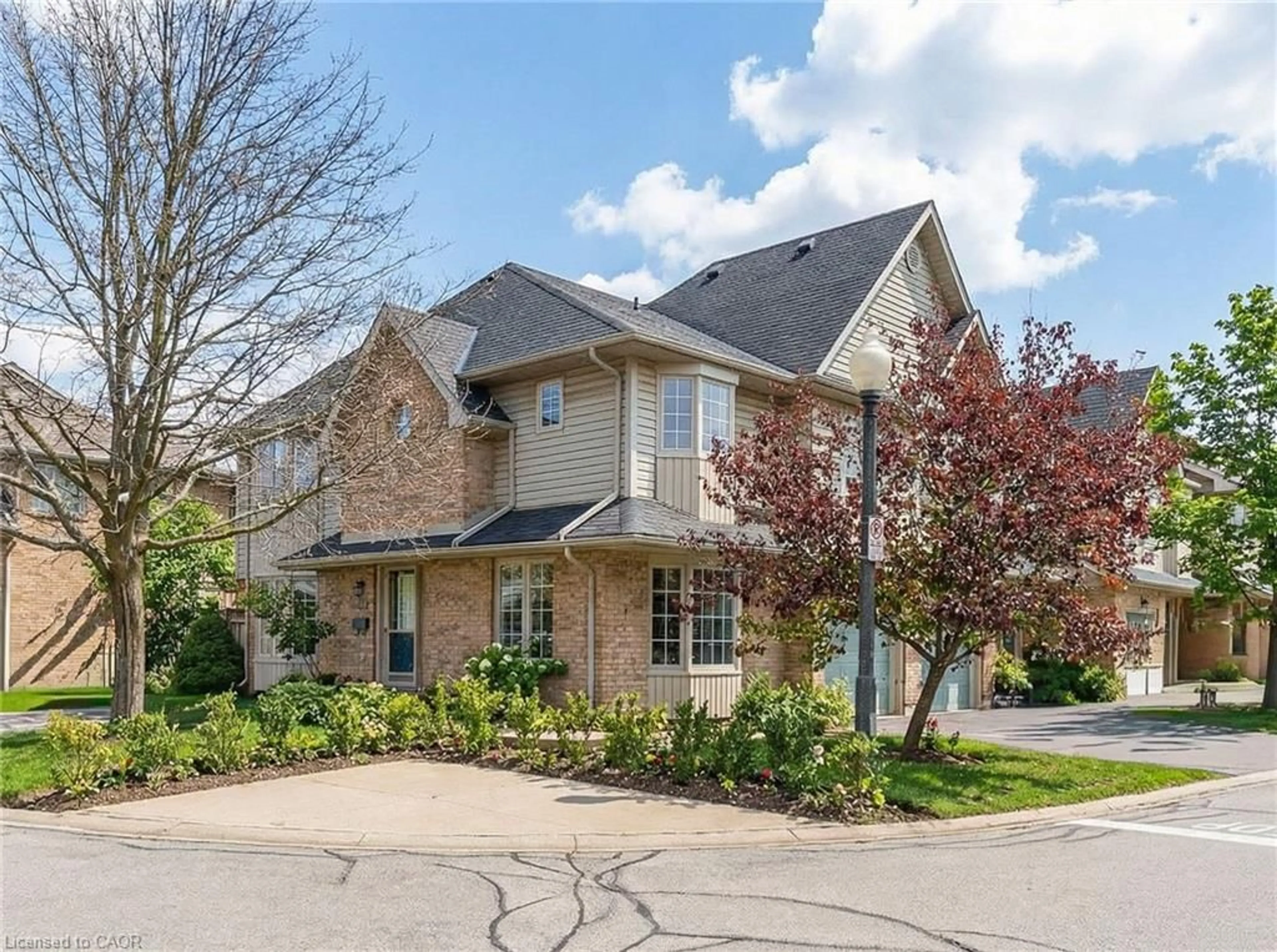 Home with brick exterior material, street for 3333 New St #120, Burlington Ontario L7N 1N1