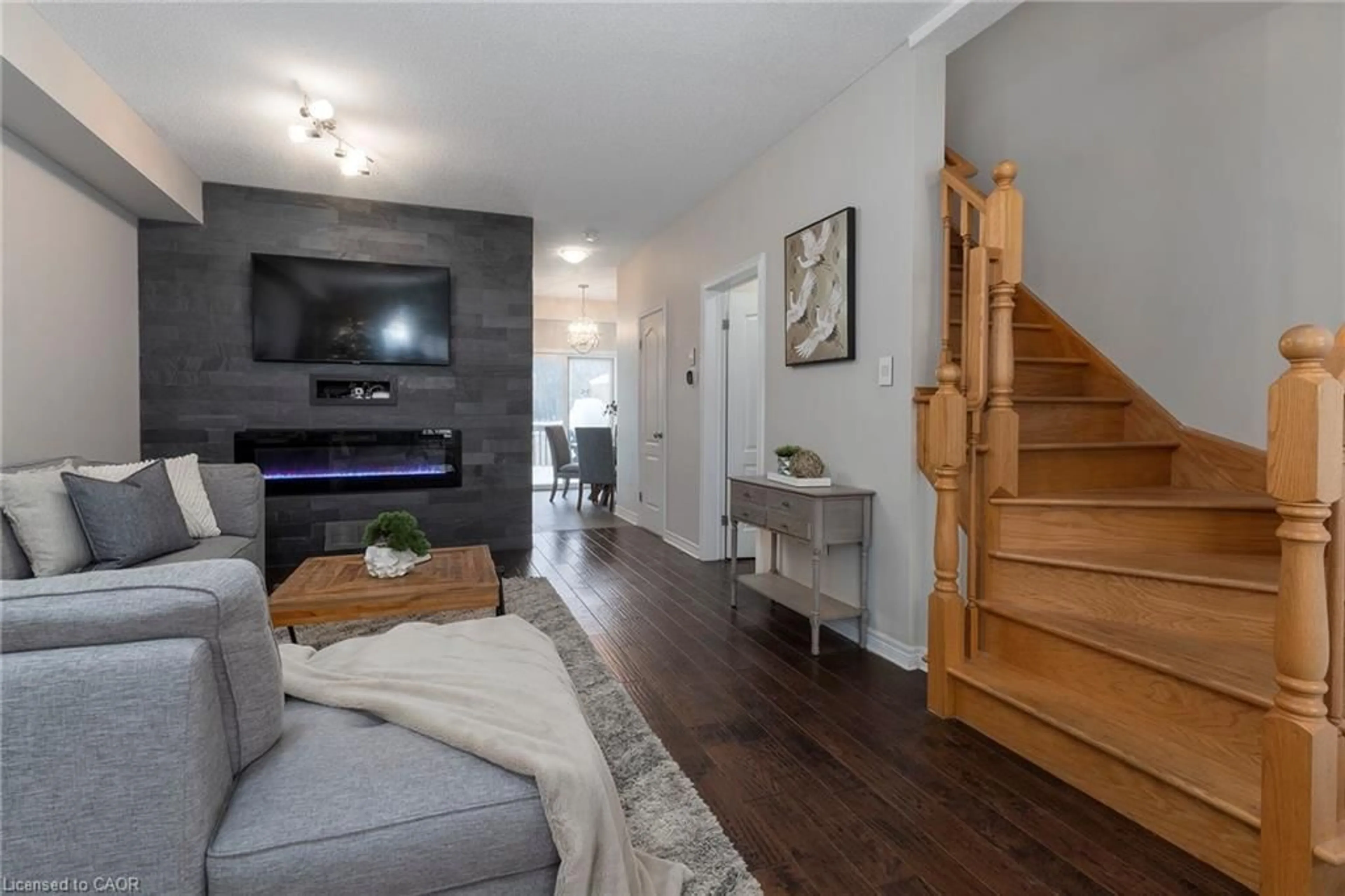 Living room with furniture, wood/laminate floor for 105 Liddycoat Lane, Ancaster Ontario L9G 0A7