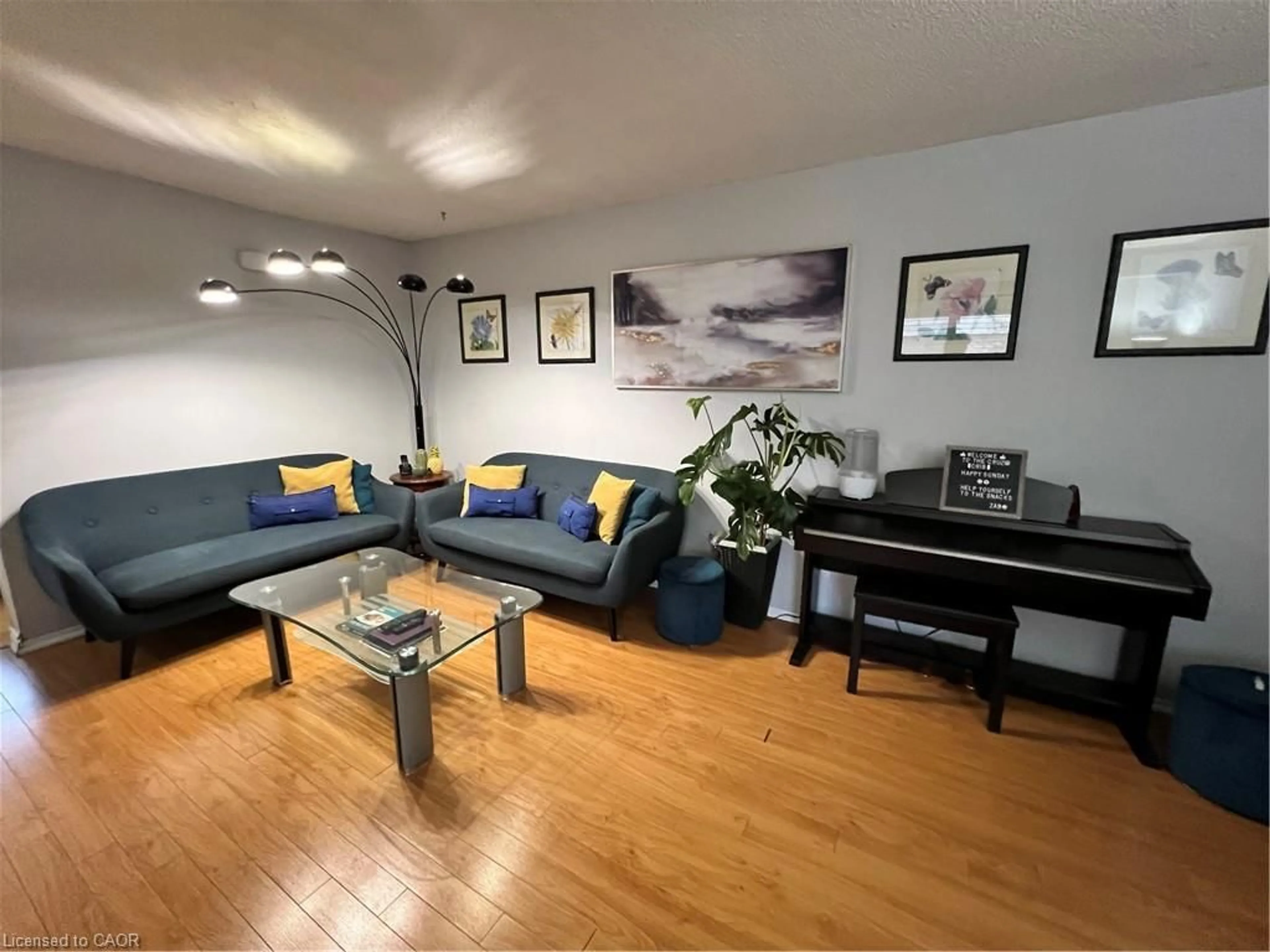 Living room with furniture, wood/laminate floor for 1300 Upper Ottawa St ##44, Hamilton Ontario L8W 1M8