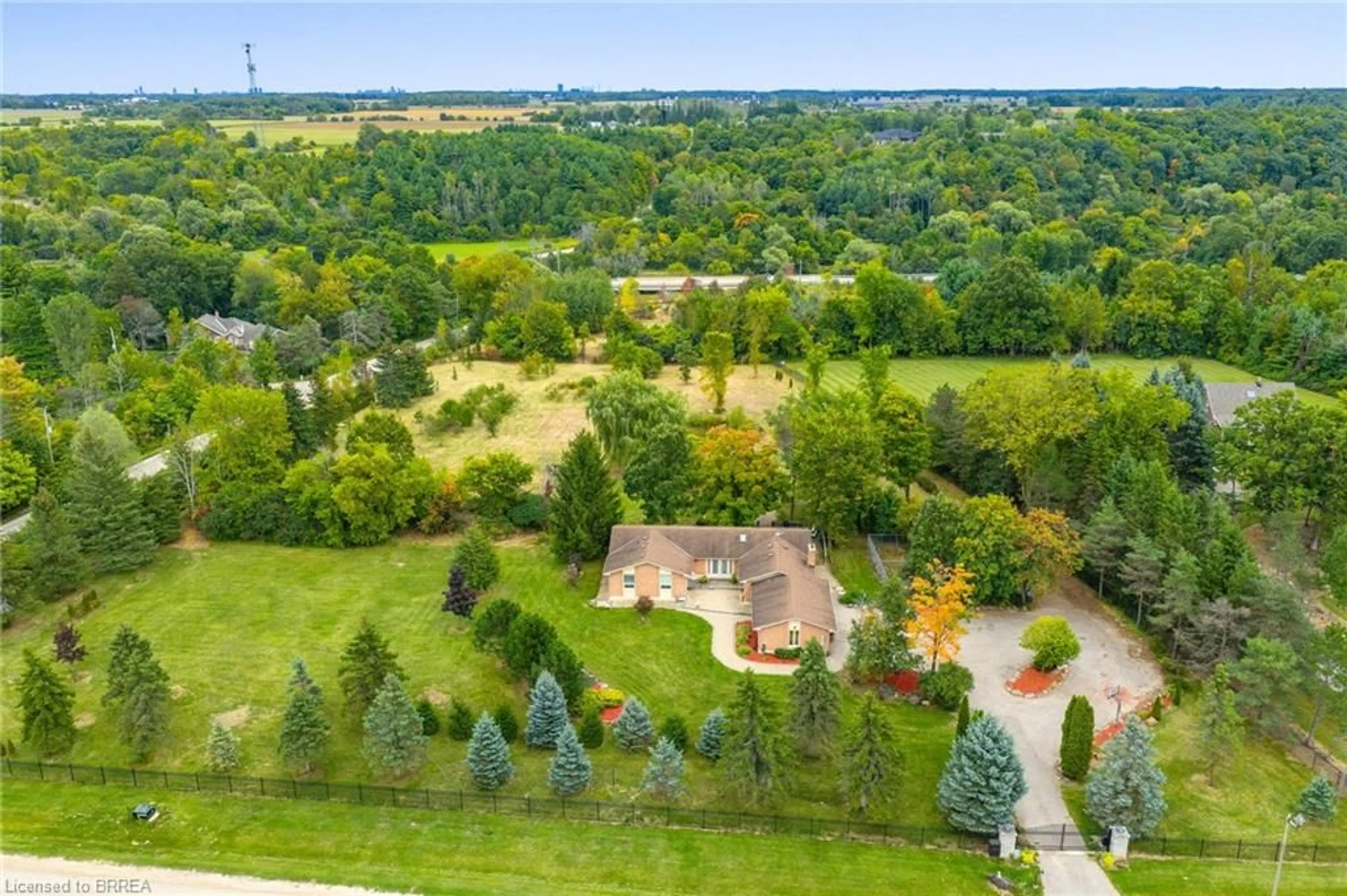 A pic from outside/outdoor area/front of a property/back of a property/a pic from drone, forest/trees view for 1 Cassidy Lane, Terra Cotta Ontario L7C 1P5