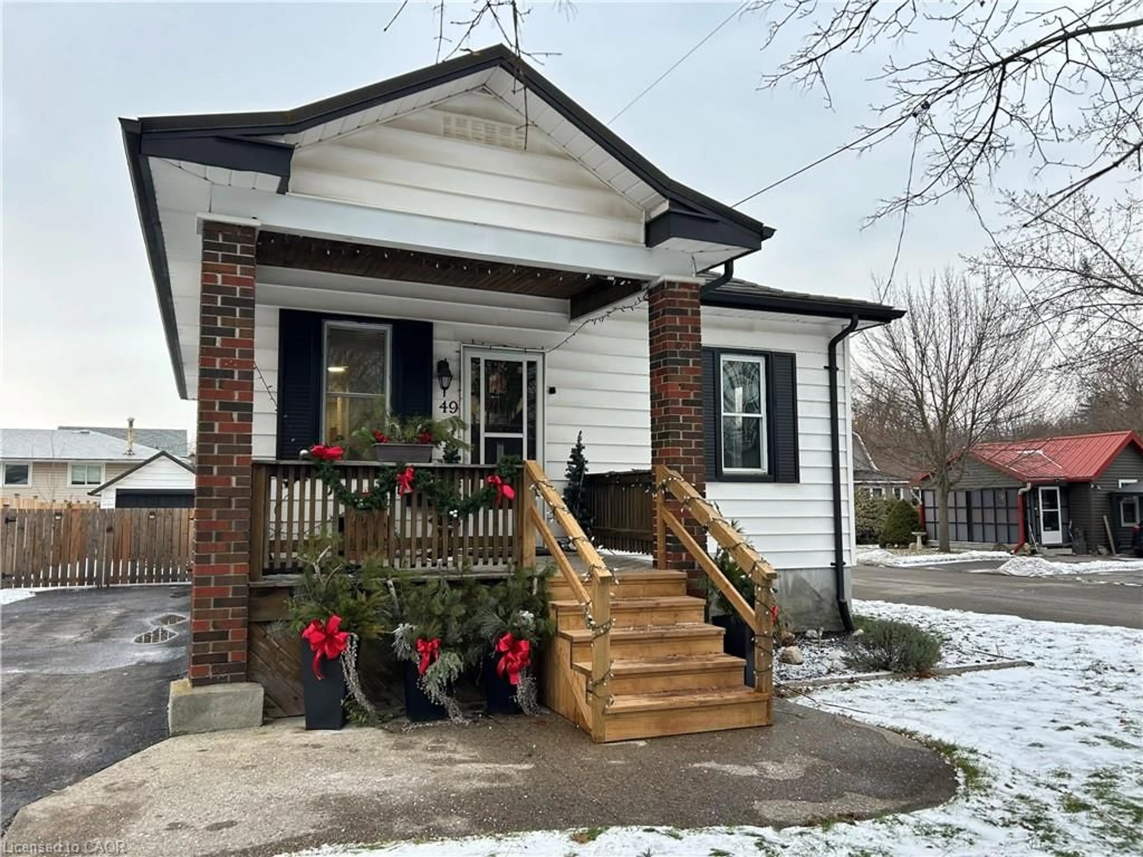 Home with brick exterior material, street for 49 Woodhouse Street, Simcoe Ontario N3Y 1E8