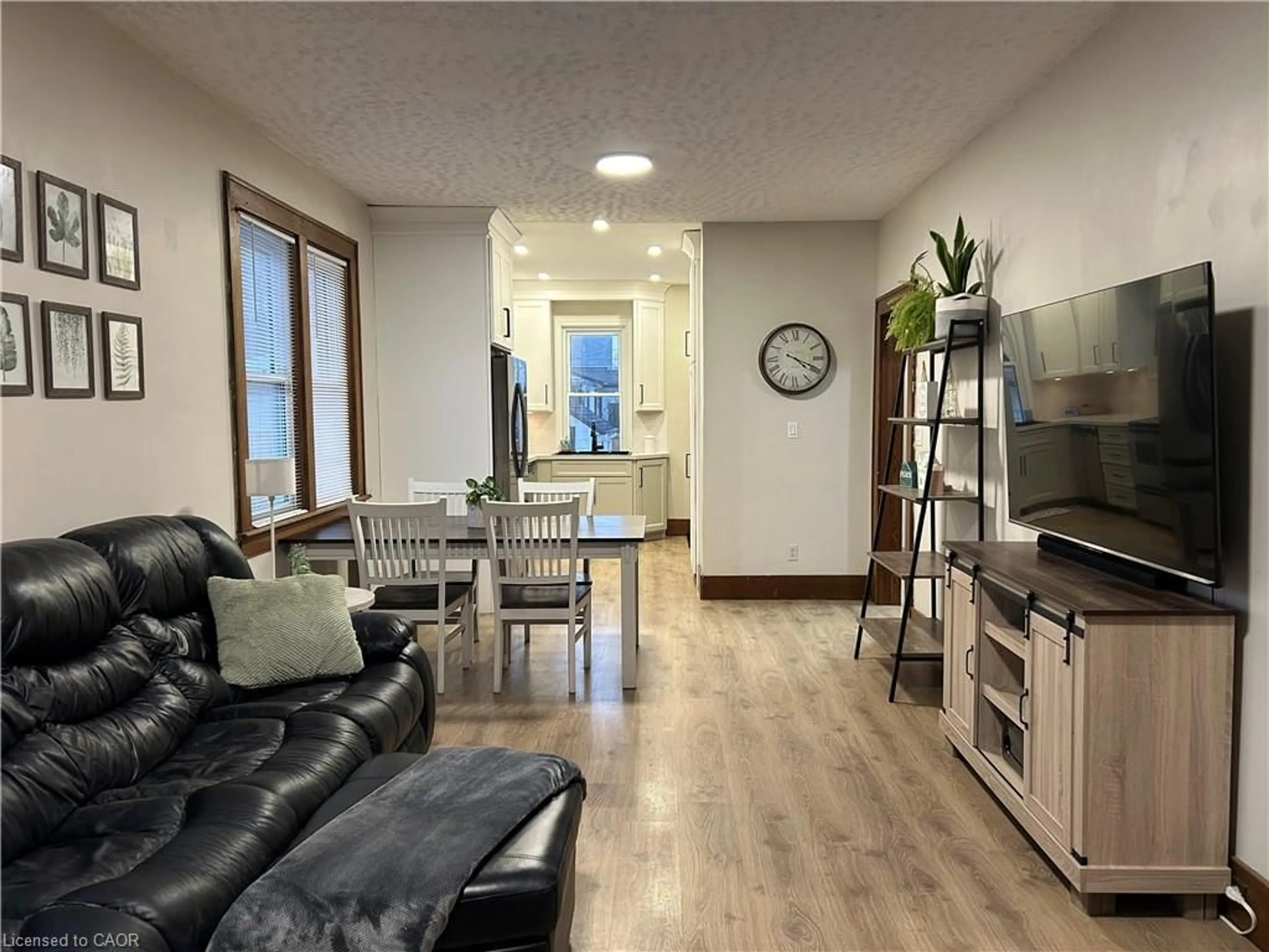 Living room with furniture, wood/laminate floor for 49 Woodhouse Street, Simcoe Ontario N3Y 1E8