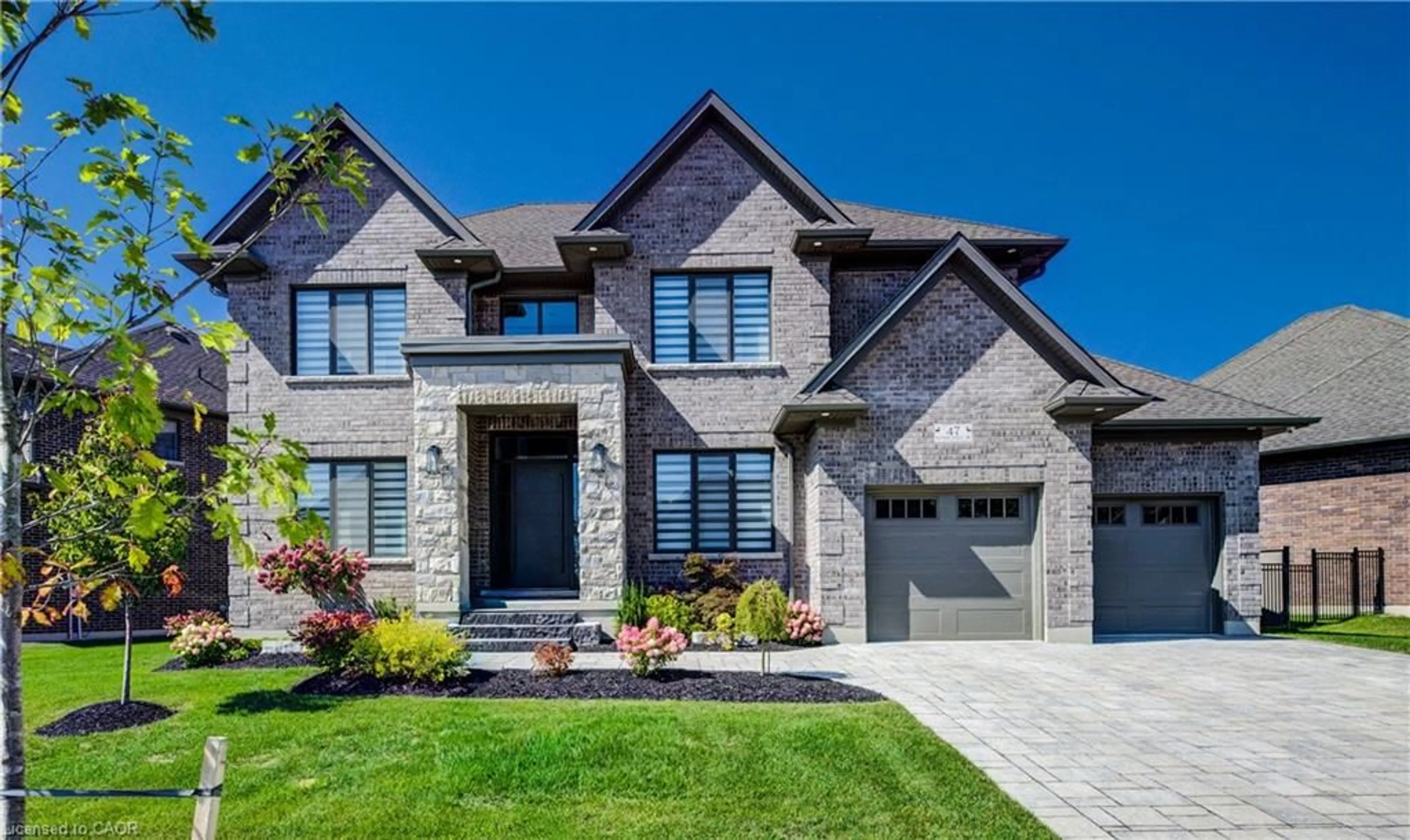 Home with brick exterior material, street for 47 Pioneer Ridge Dr, Kitchener Ontario N2P 0G6
