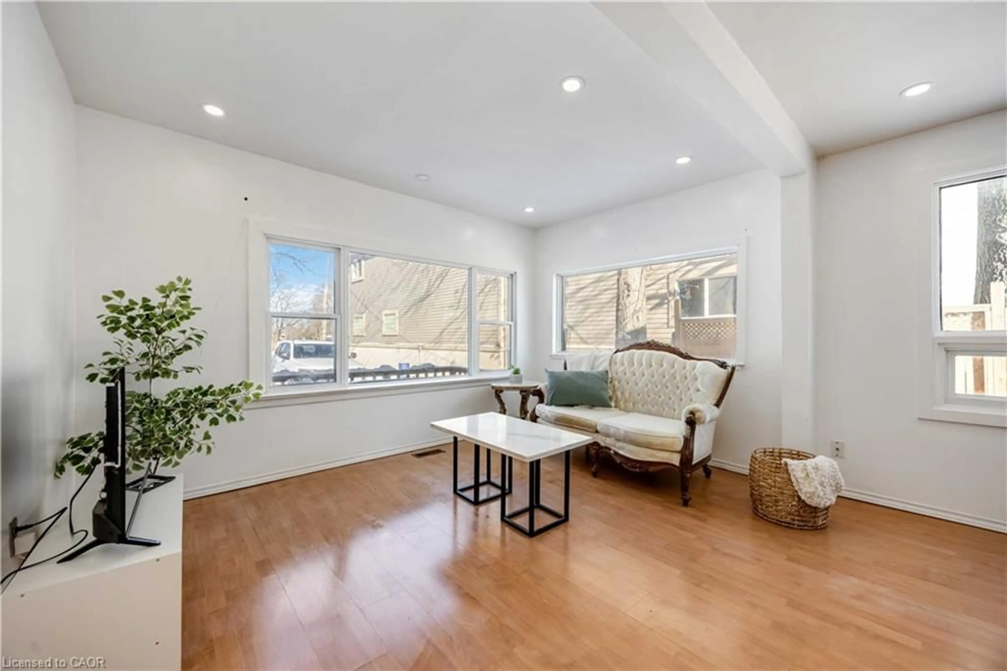 Living room with furniture, wood/laminate floor for 665 Lakeshore Rd, Sarnia Ontario N7V 2T1