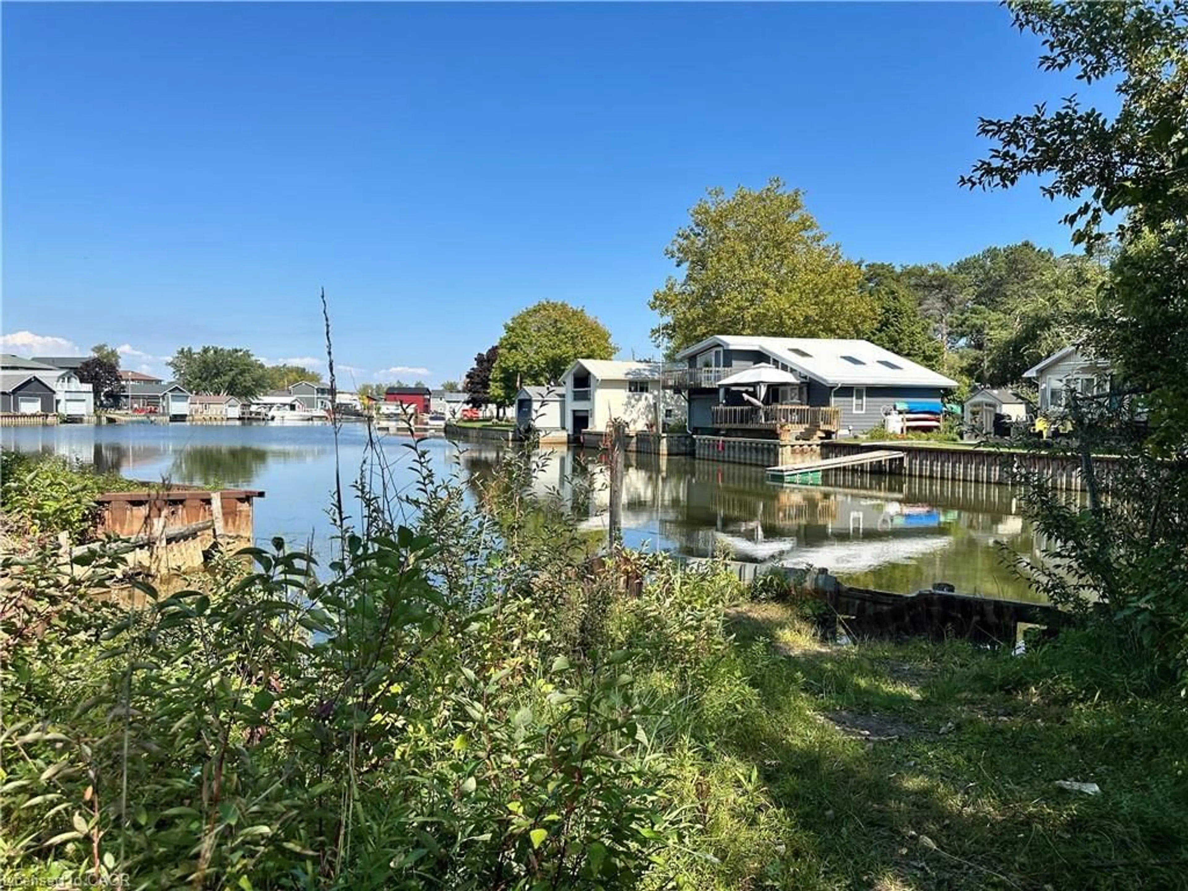 A pic from outside/outdoor area/front of a property/back of a property/a pic from drone, water/lake/river/ocean view for 23 Old Cut Blvd, Long Point Ontario N0E 1M0