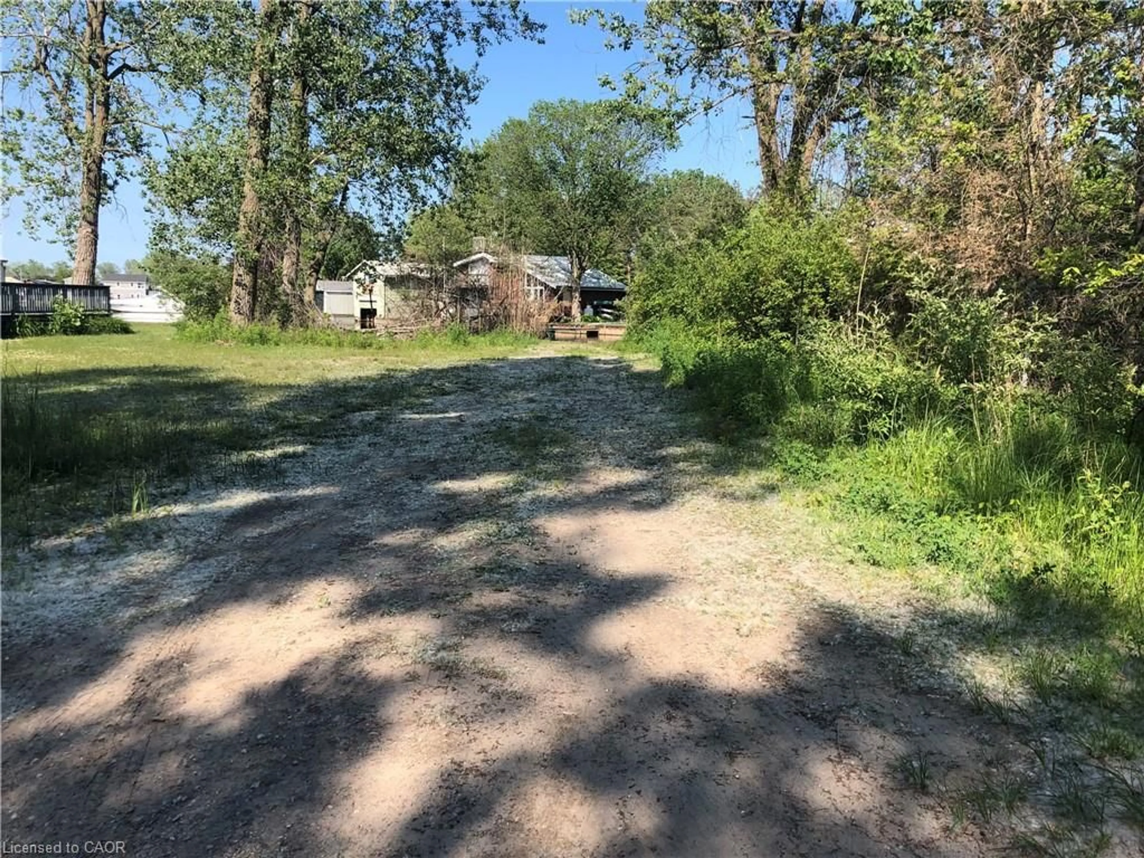 A pic from outside/outdoor area/front of a property/back of a property/a pic from drone, forest/trees view for 23 Old Cut Blvd, Long Point Ontario N0E 1M0