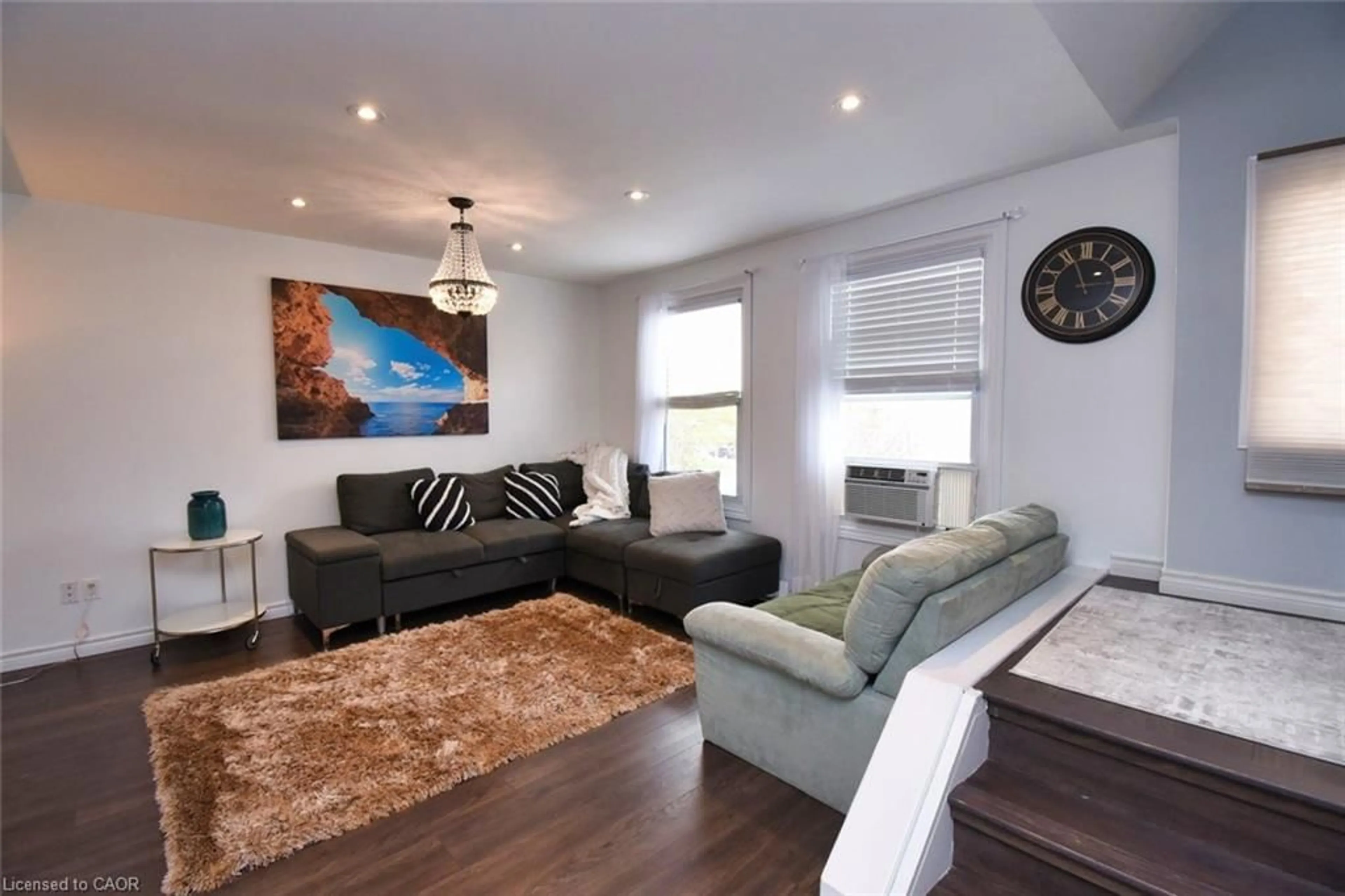 Living room with furniture, wood/laminate floor for 1255 Upper Gage Ave #15, Hamilton Ontario L8W 3C7