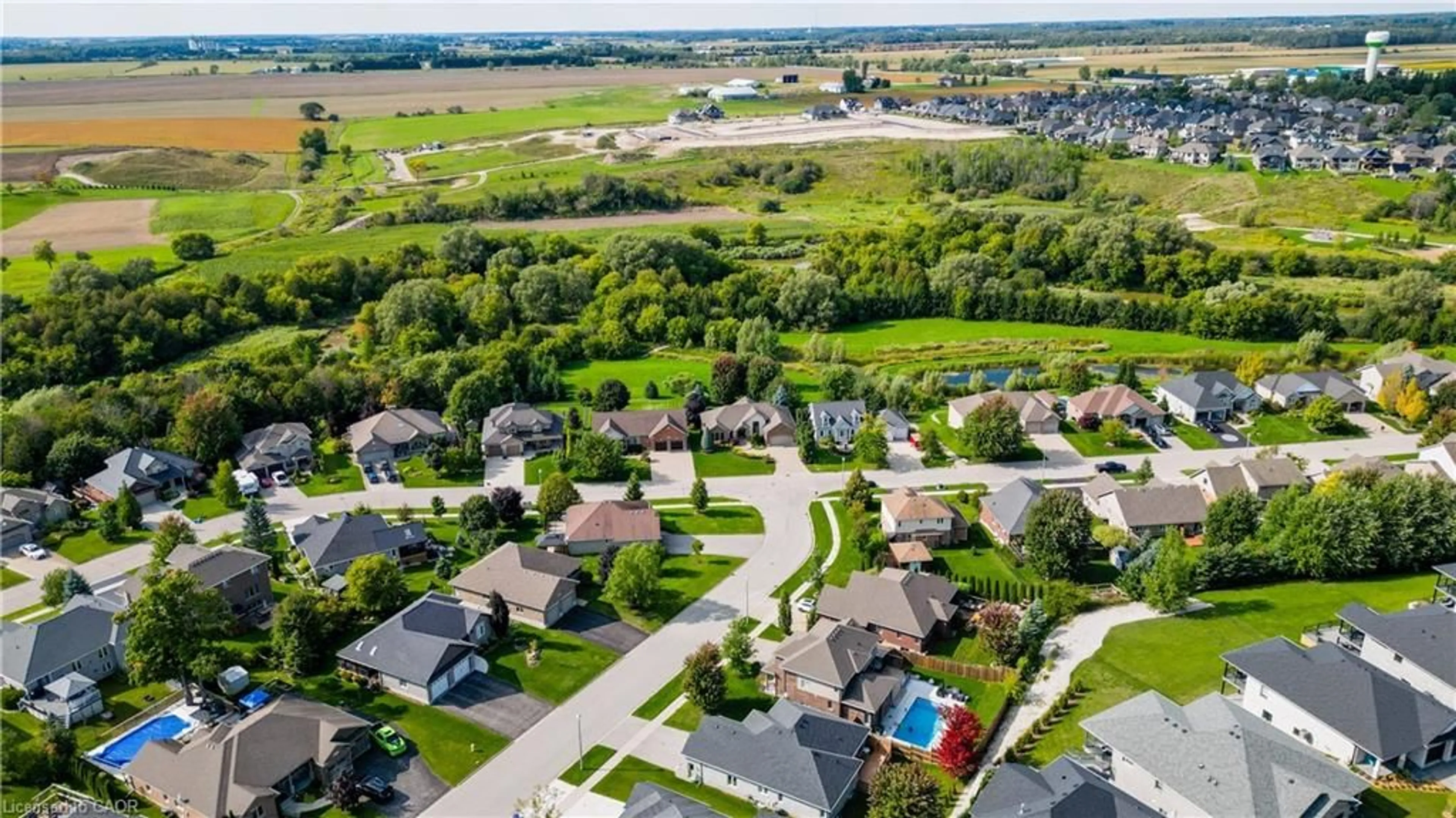 A pic from outside/outdoor area/front of a property/back of a property/a pic from drone, street for 118 River Run Rd, Drayton Ontario N0G 1P0