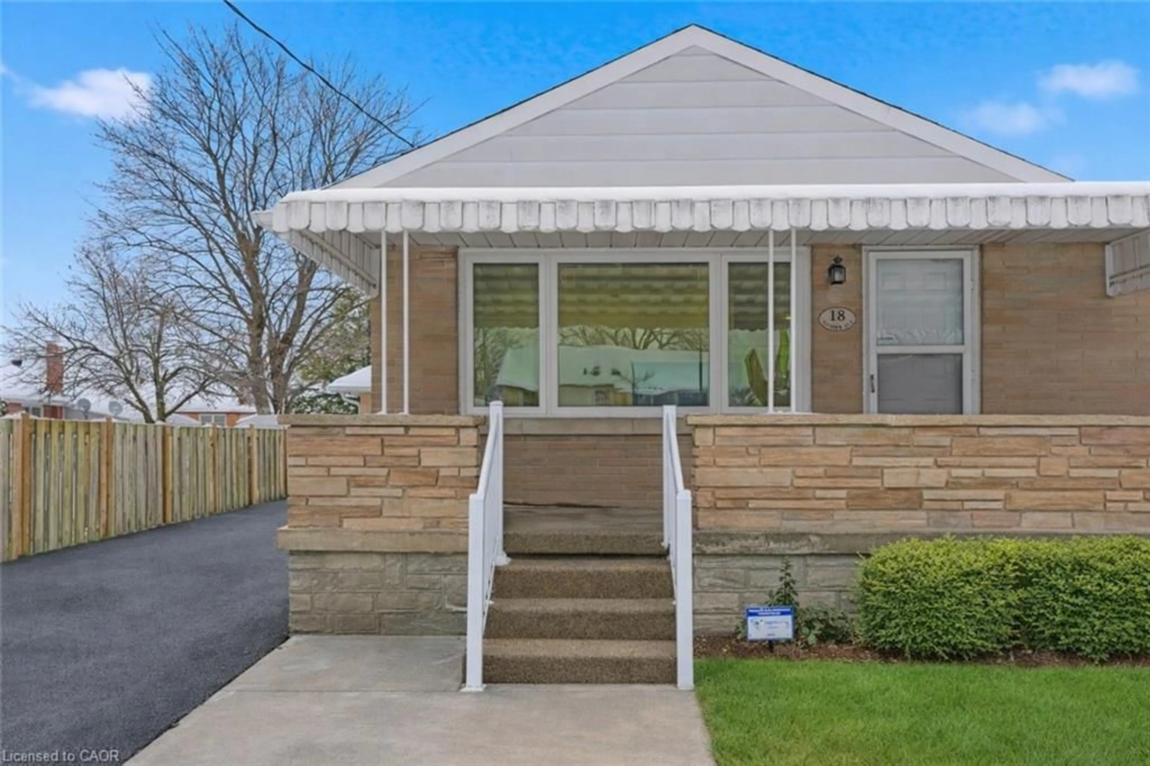 Home with vinyl exterior material, street for 18 Harber Ave, Kitchener Ontario N2C 1Y8