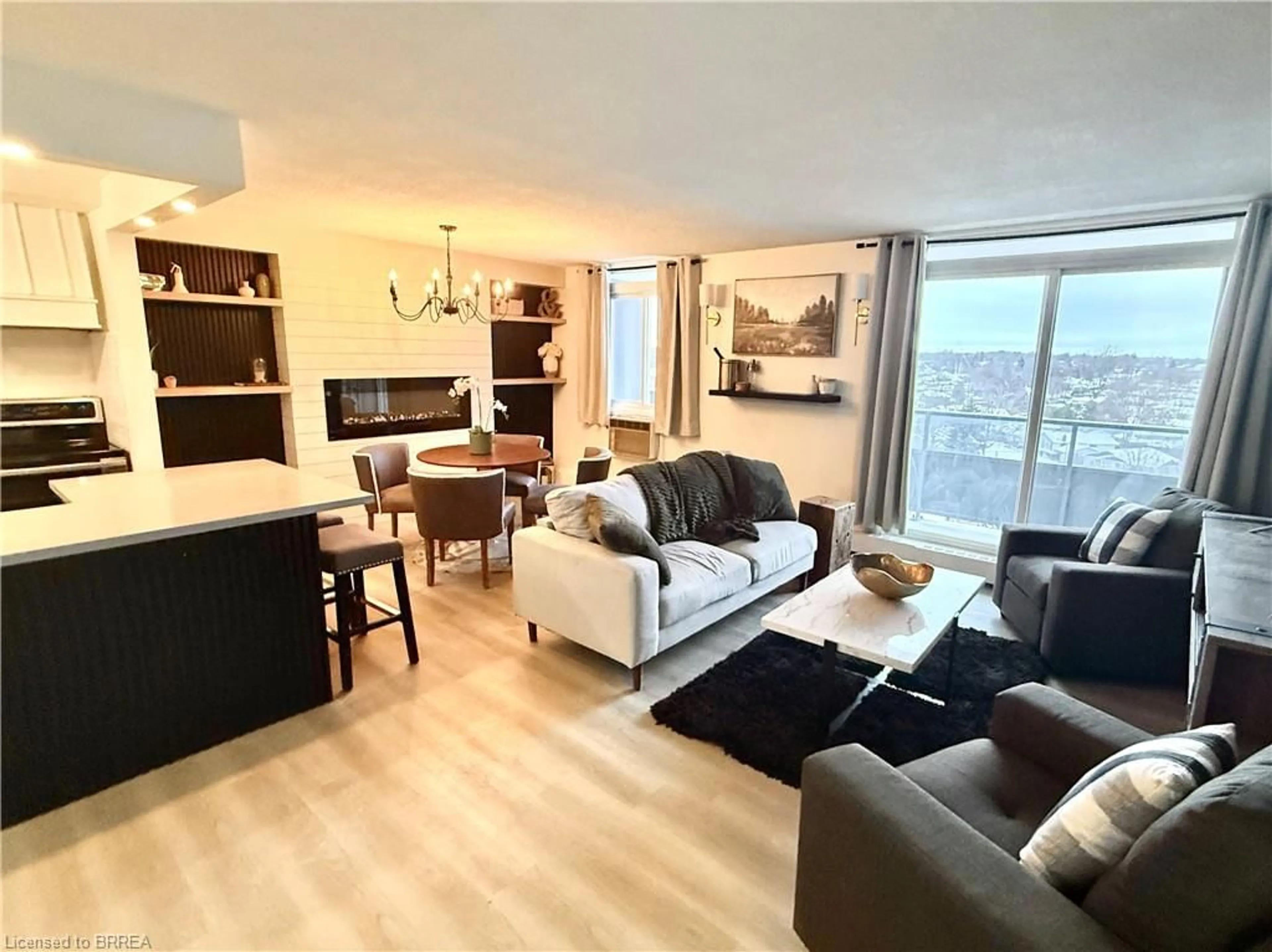 Living room with furniture, wood/laminate floor for 640 West St #908, Brantford Ontario N3R 6M3