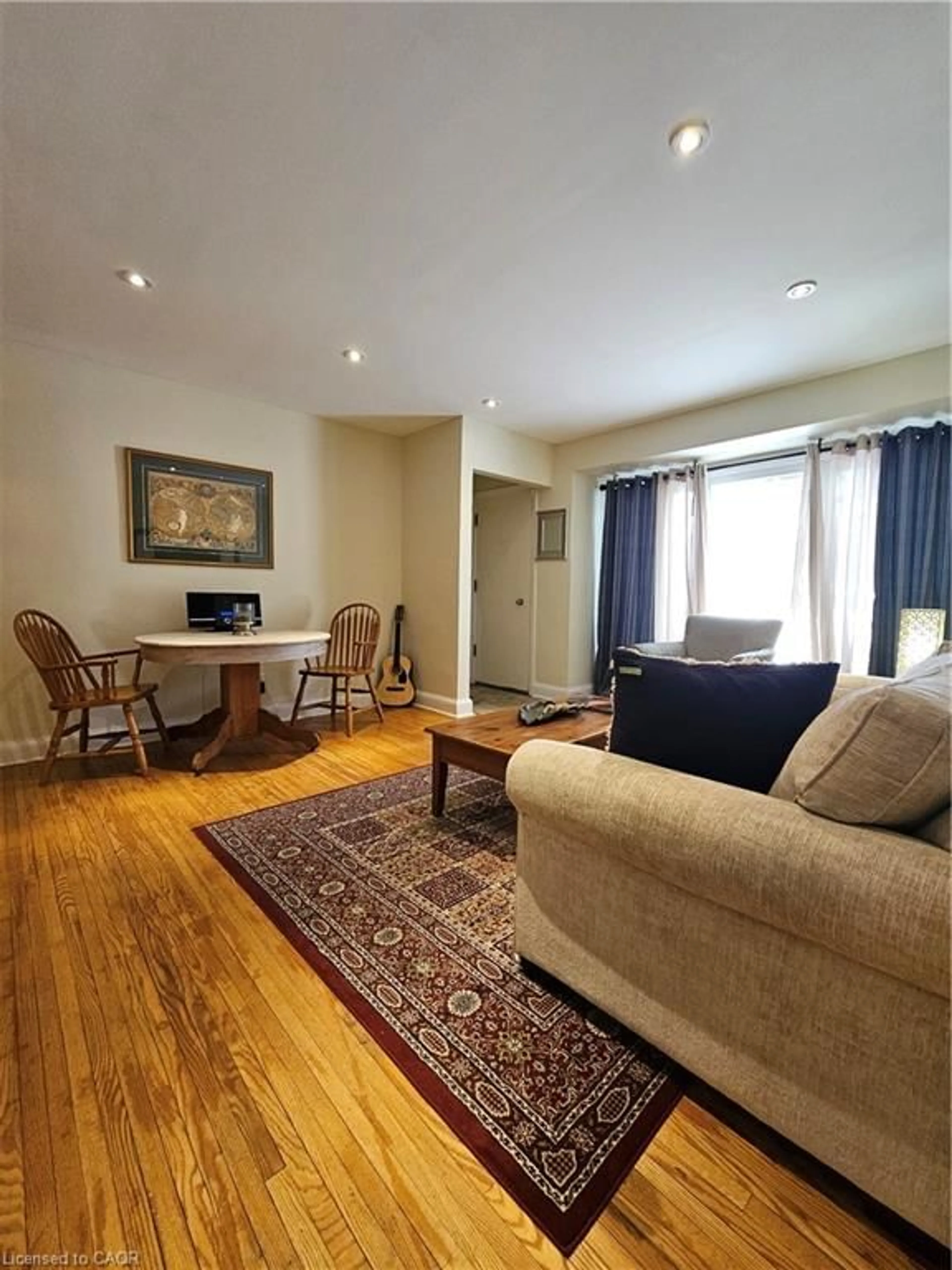 Living room with furniture, wood/laminate floor for 379 St. Leger St, Kitchener Ontario N2H 4M8